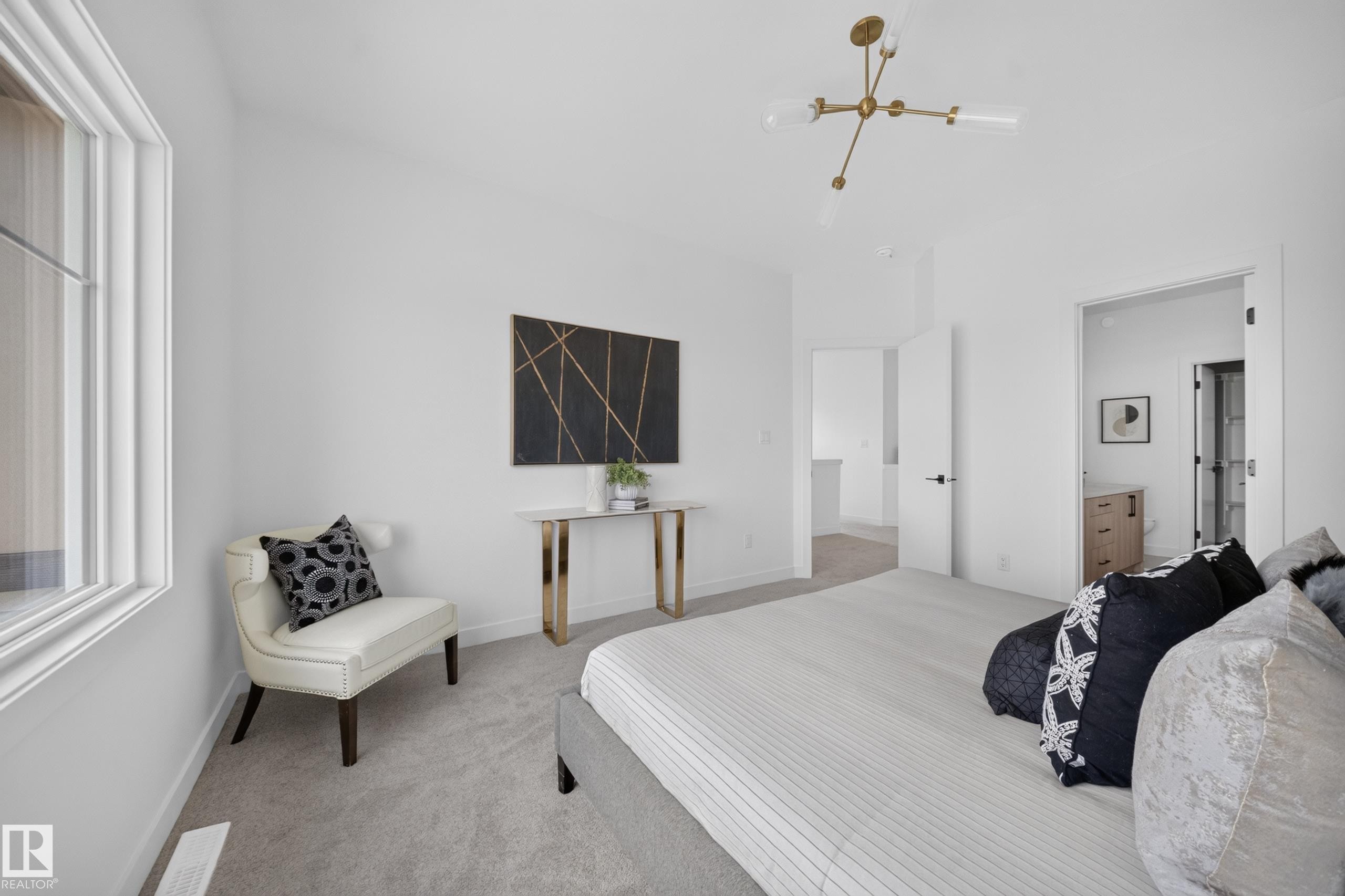 Spacious room featuring neutral carpeting and white wall finishes - 523 Ashgrove Circle, Leduc, AB