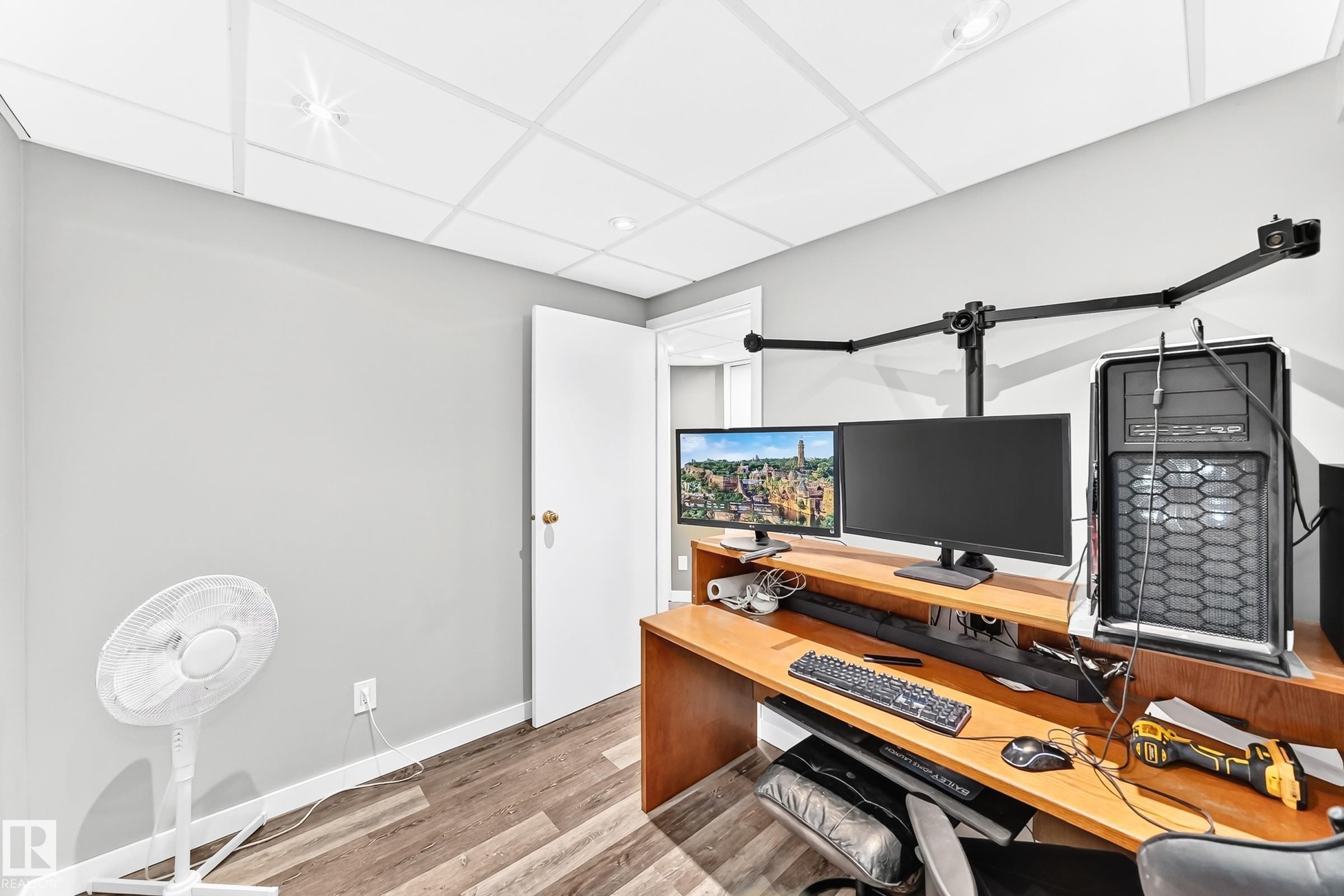 Neutral gray wall paint and wood-finish flooring - 1763 48A Street, Edmonton, AB