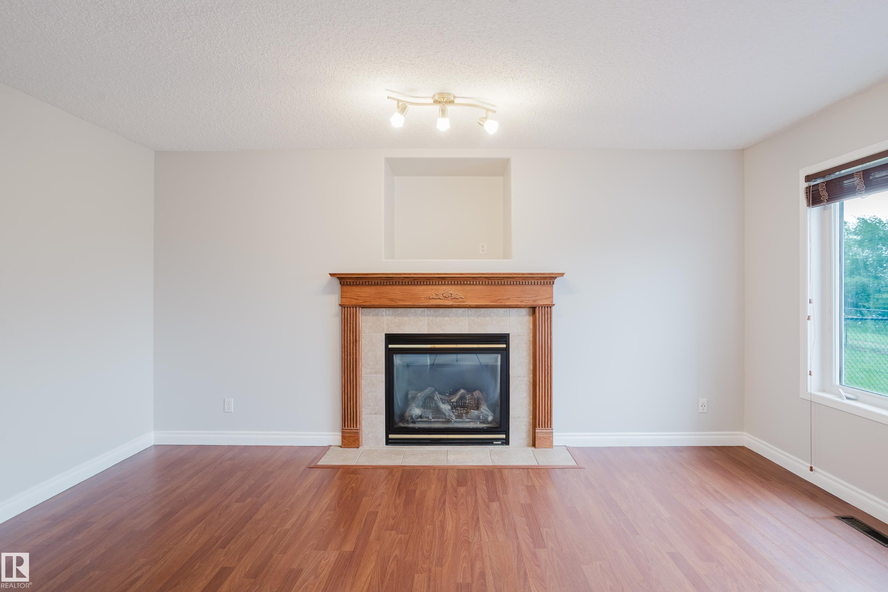 611 Hooke Court Nw, Edmonton, AB - Indoor Photo Showing Living Room With Fireplace