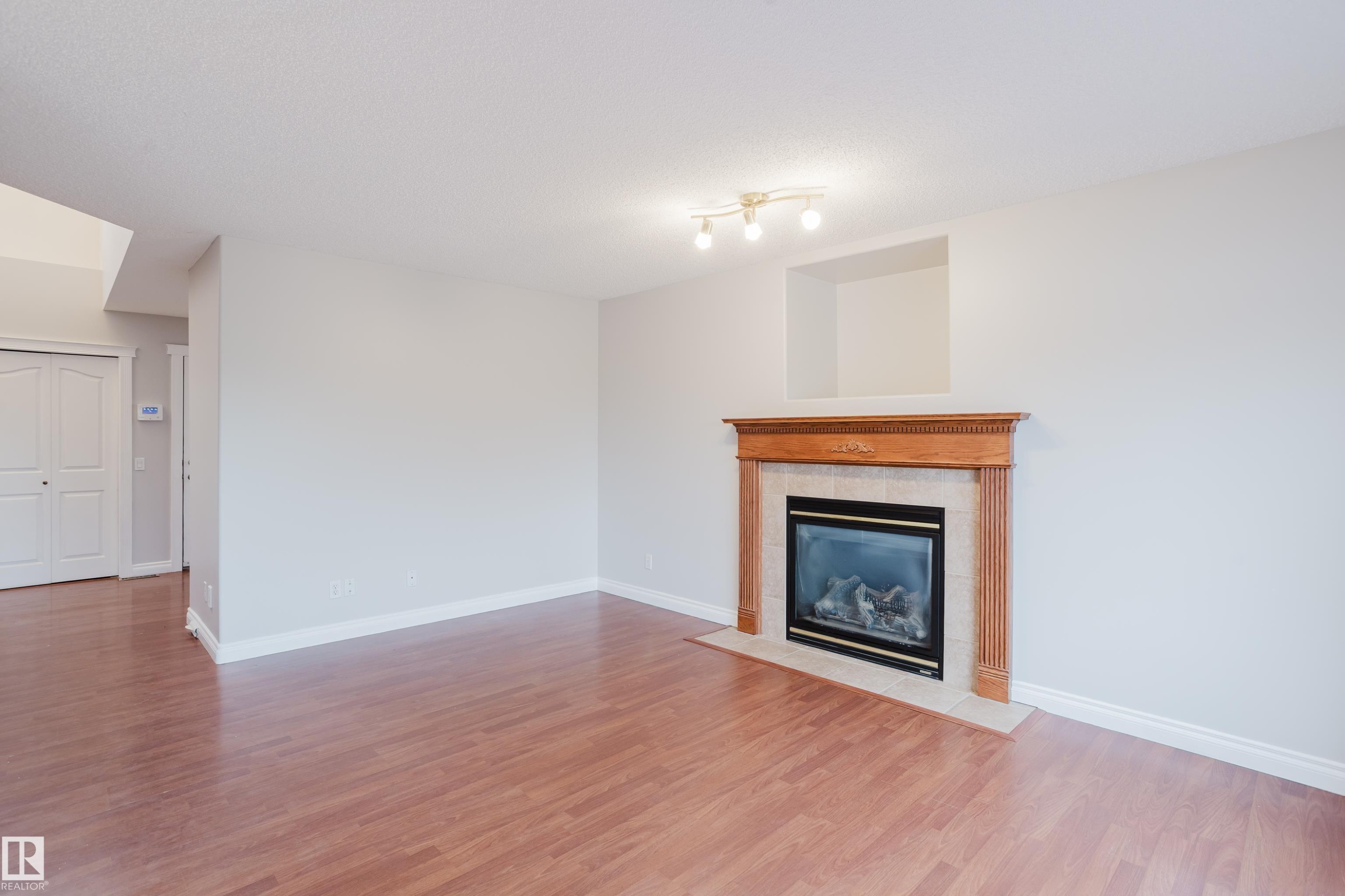 611 Hooke Court Nw, Edmonton, AB - Indoor Photo Showing Living Room With Fireplace