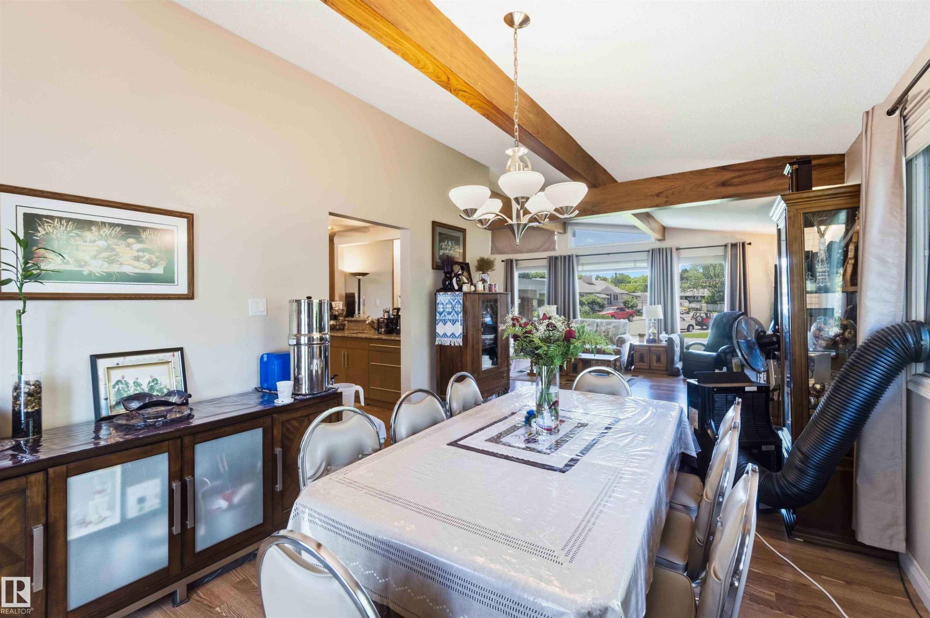 Vaulted ceilings featuring exposed wood beams enhance this dining area - 13121 122 Street, Edmonton, AB