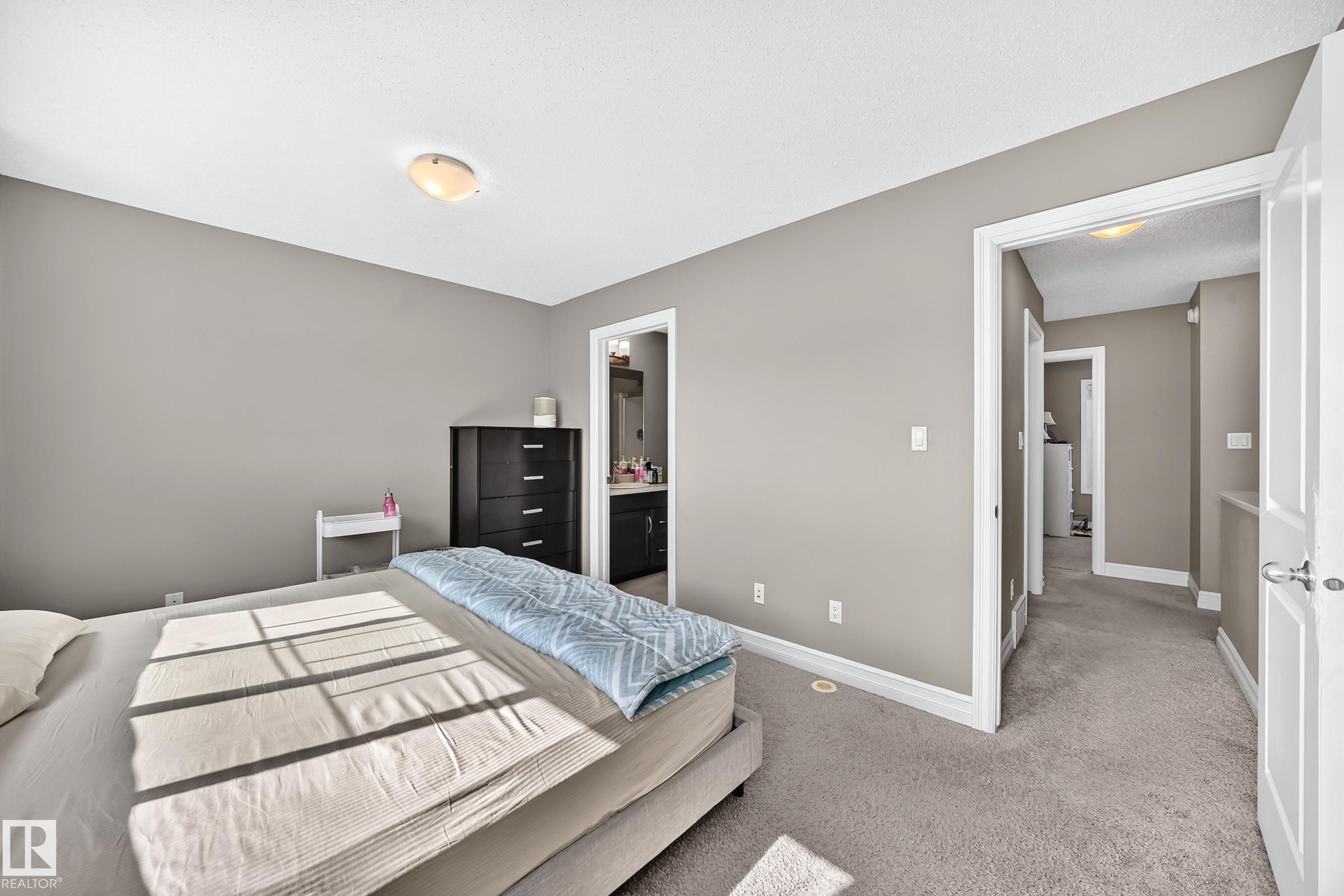 Bedroom featuring neutral tone walls, recessed lighting, and carpet flooring - 415 Clareview Rd Nw Nw, Edmonton, AB - Indoor Photo Showing Bedroom