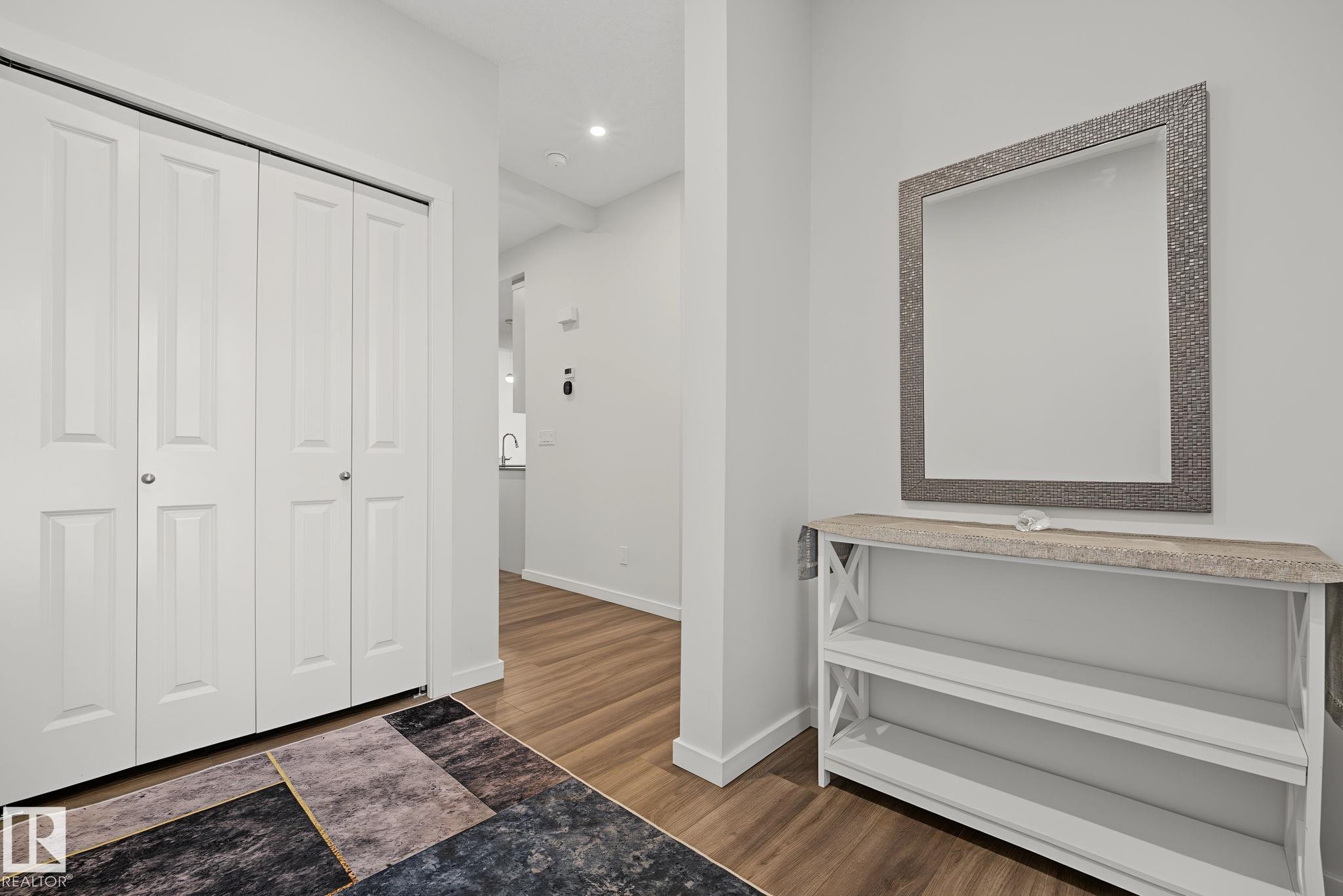 Well-lit entry area featuring light wood-finish flooring - 432 Roberts Crescent, Leduc, AB