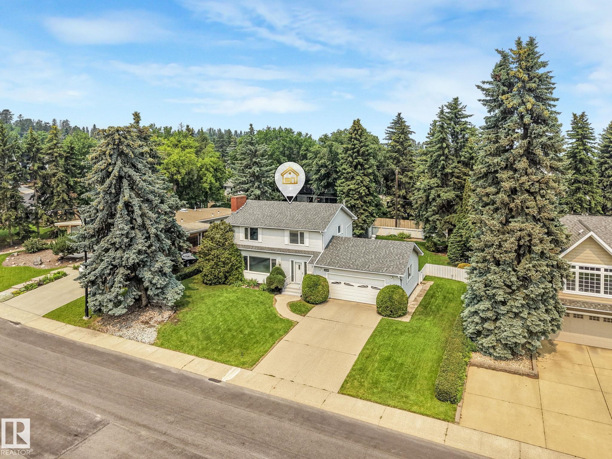 Traditional-style residence with light-colored siding and a gray shingle roof - 13320 79 Avenue Nw, Edmonton, AB - Outdoor