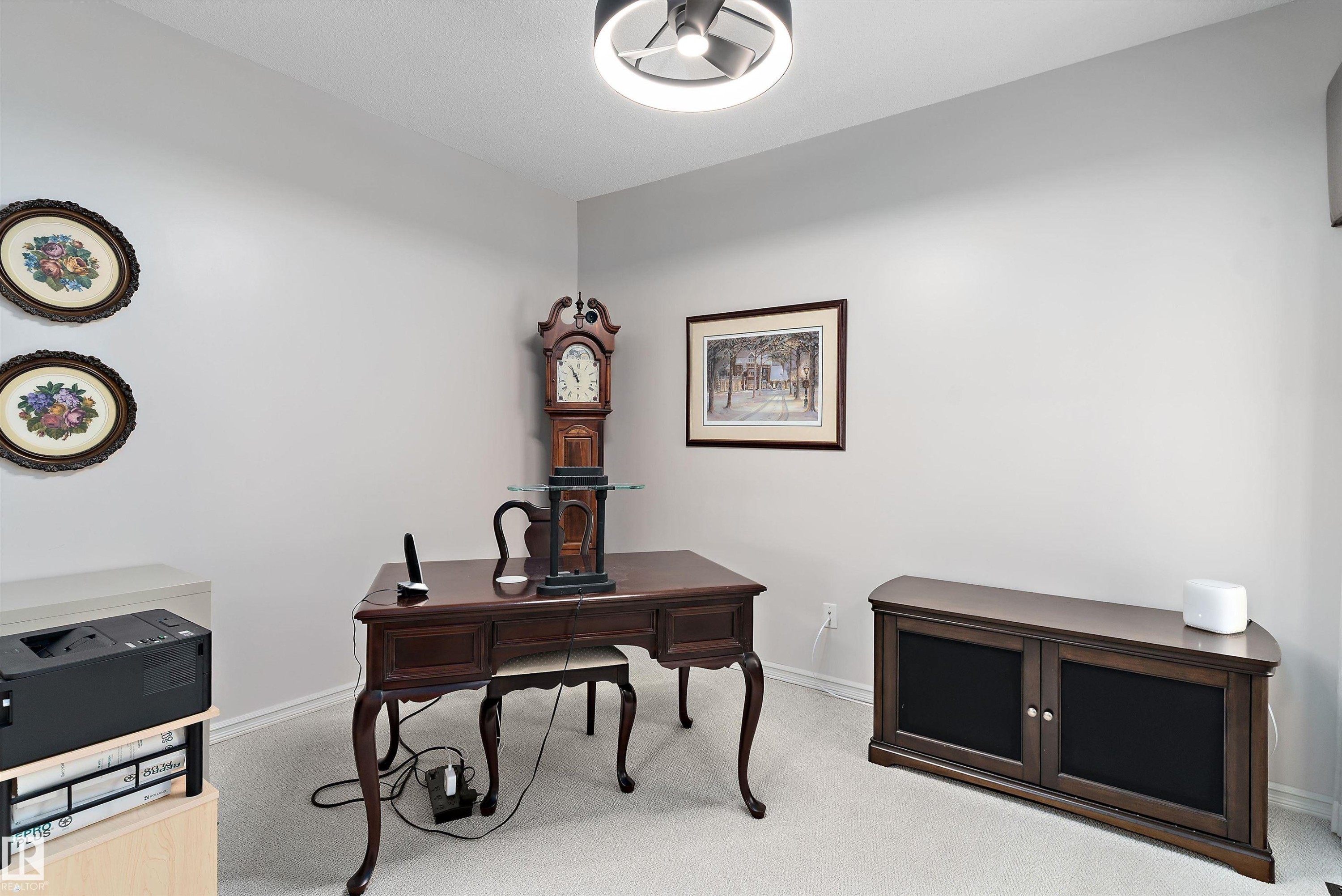 Carpeted room with light gray walls and white trim - 1097 Armitage Crescent, Edmonton, AB