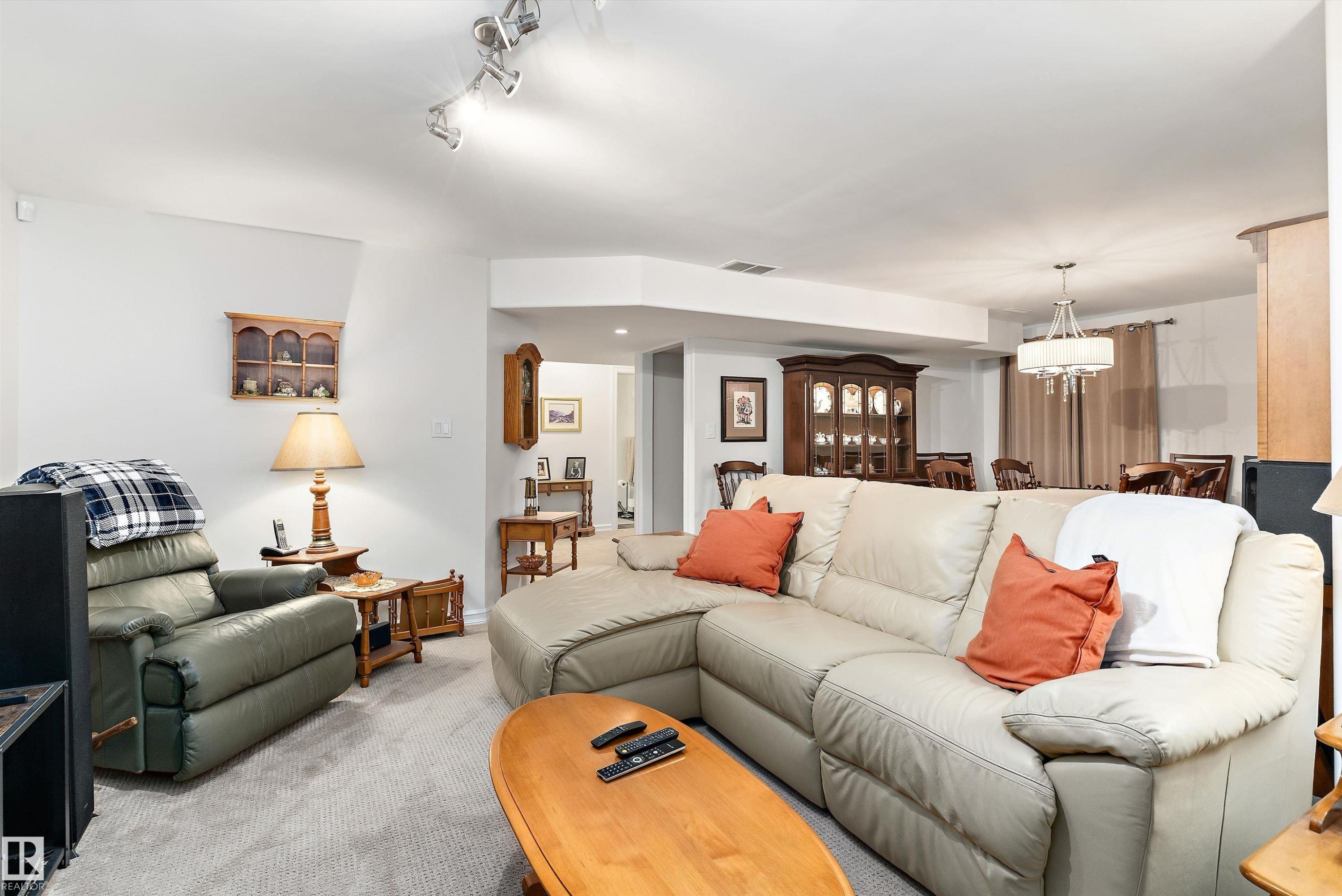 Carpeted living area with recessed lighting and track lighting fixtures - 1097 Armitage Crescent, Edmonton, AB