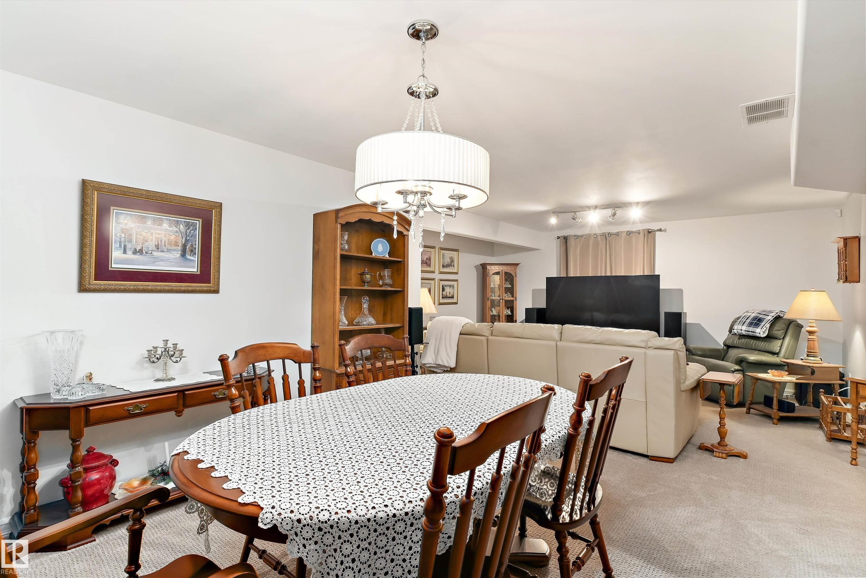 Spacious interior with neutral wall colors and light-colored carpeting - 1097 Armitage Crescent, Edmonton, AB