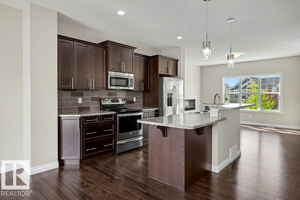 2 Simmonds Place, Leduc, AB - Indoor Photo Showing Kitchen With Upgraded Kitchen