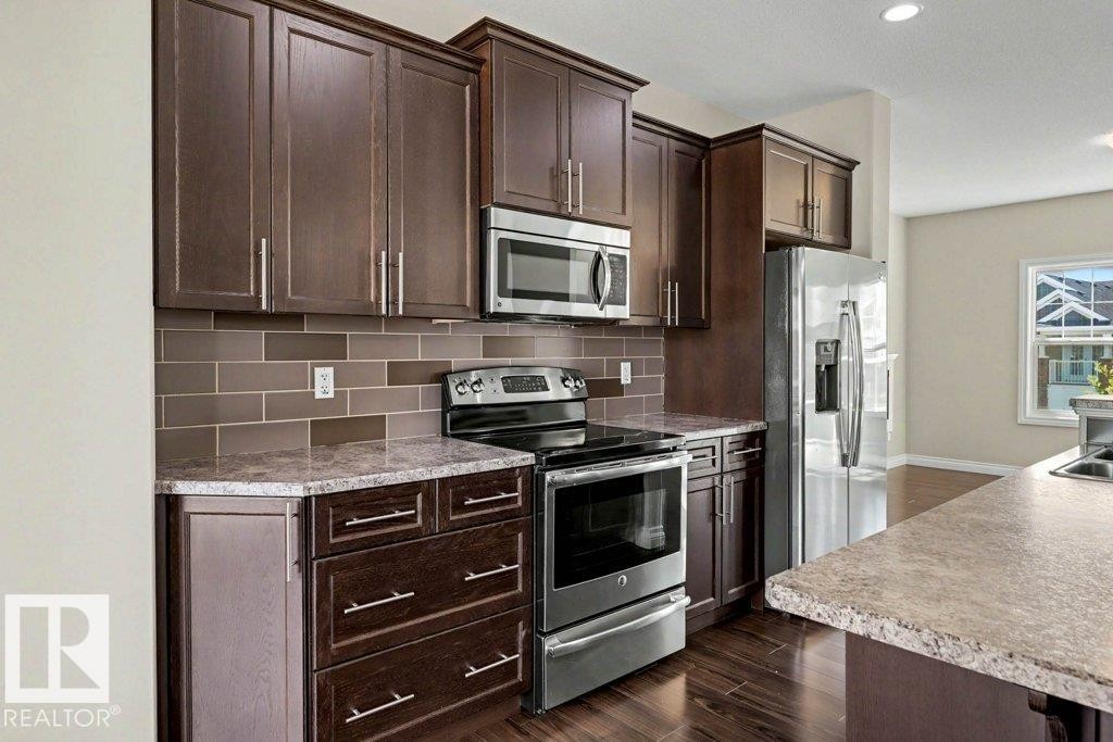 2 Simmonds Place, Leduc, AB - Indoor Photo Showing Kitchen With Upgraded Kitchen