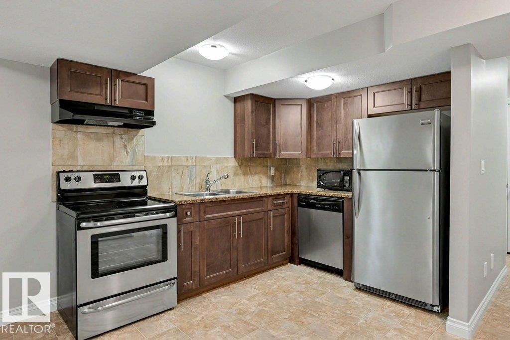2 Simmonds Place, Leduc, AB - Indoor Photo Showing Kitchen With Double Sink
