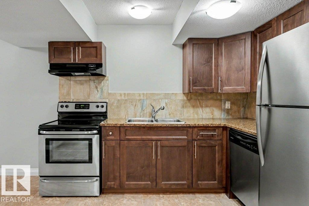 2 Simmonds Place, Leduc, AB - Indoor Photo Showing Kitchen With Double Sink