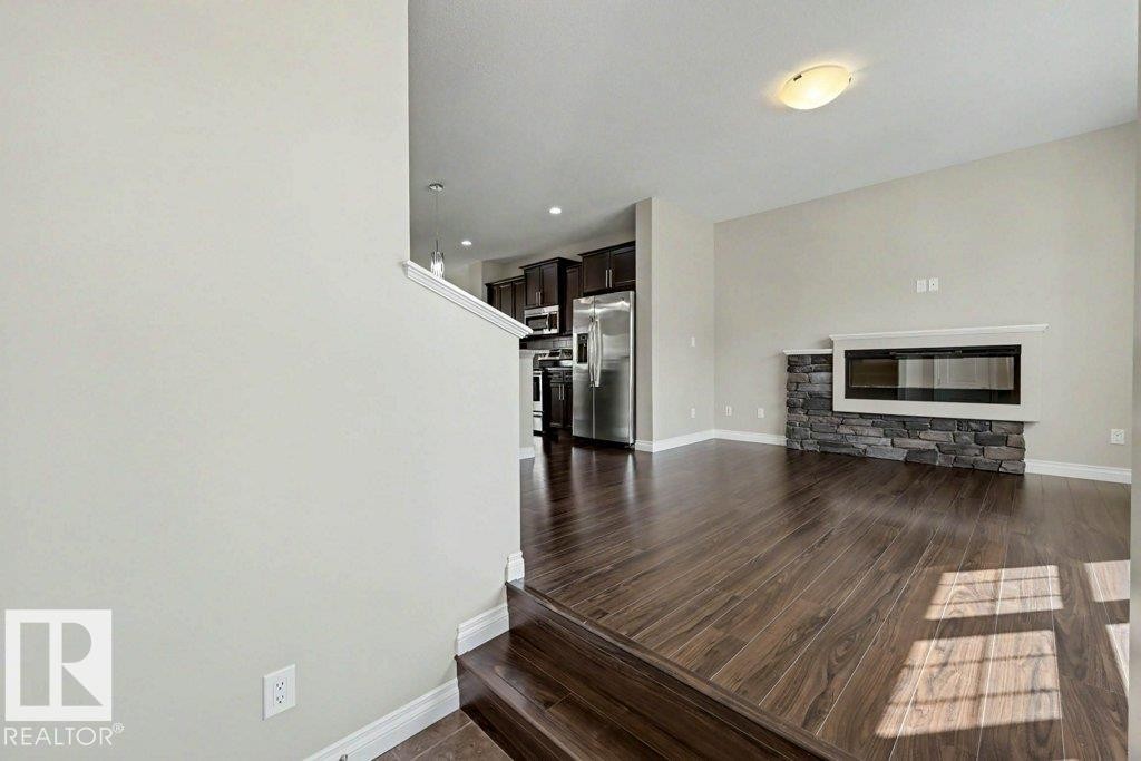 2 Simmonds Place, Leduc, AB - Indoor Photo Showing Living Room With Fireplace