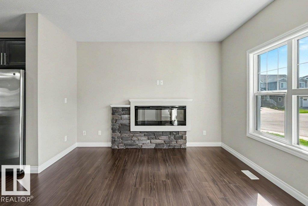2 Simmonds Place, Leduc, AB - Indoor Photo Showing Living Room With Fireplace