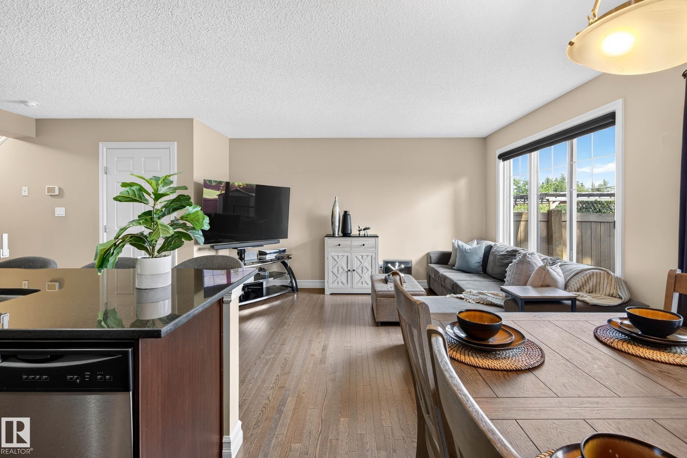 Open-concept living space with wood-finish flooring - 12119 167A Avenue, Edmonton, AB