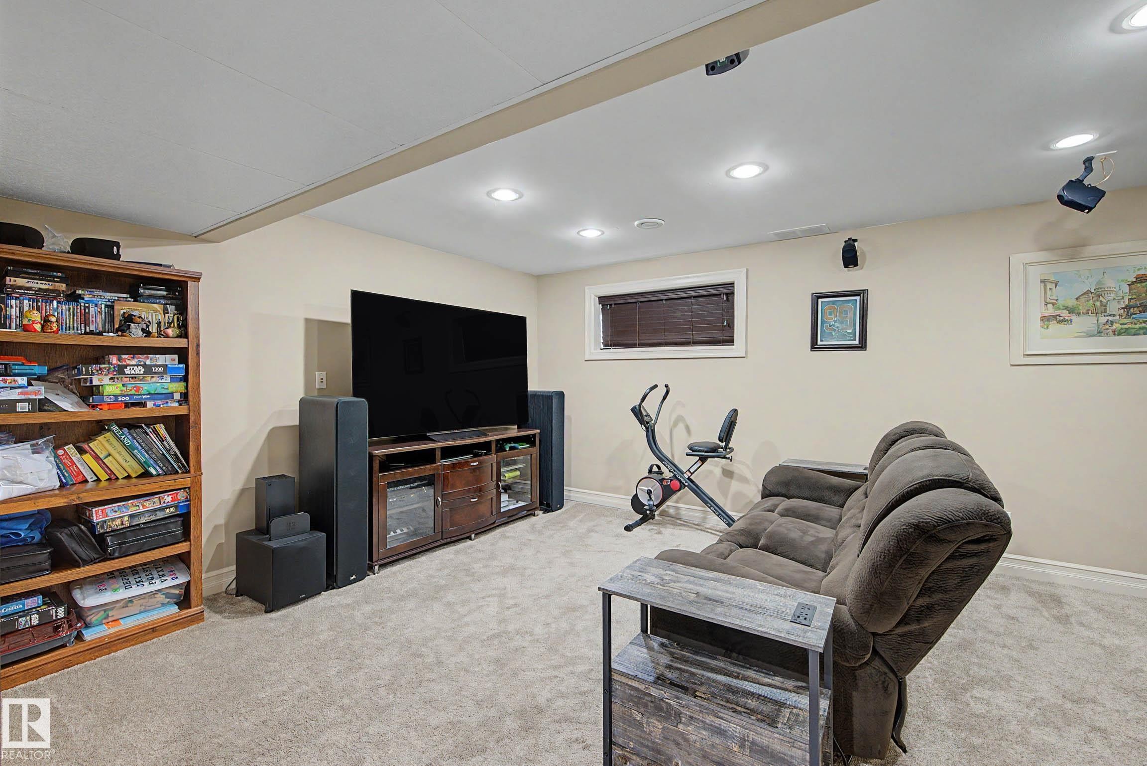 Lower-level room featuring recessed lighting, light-toned walls, and plush carpeting - 12119 167A Avenue, Edmonton, AB