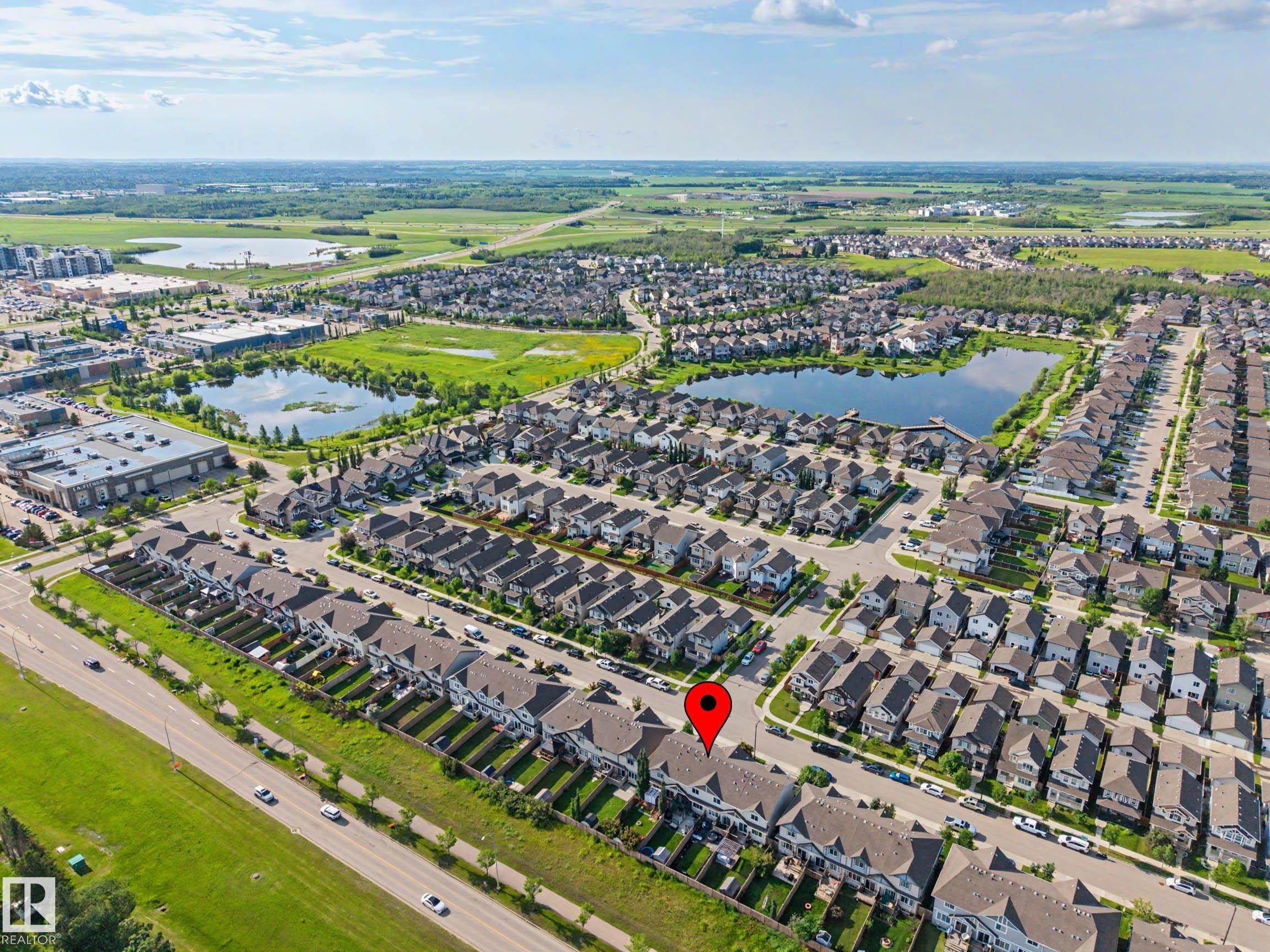 Aerial perspective of a developed residential community with multiple housing structures - 12119 167A Avenue, Edmonton, AB