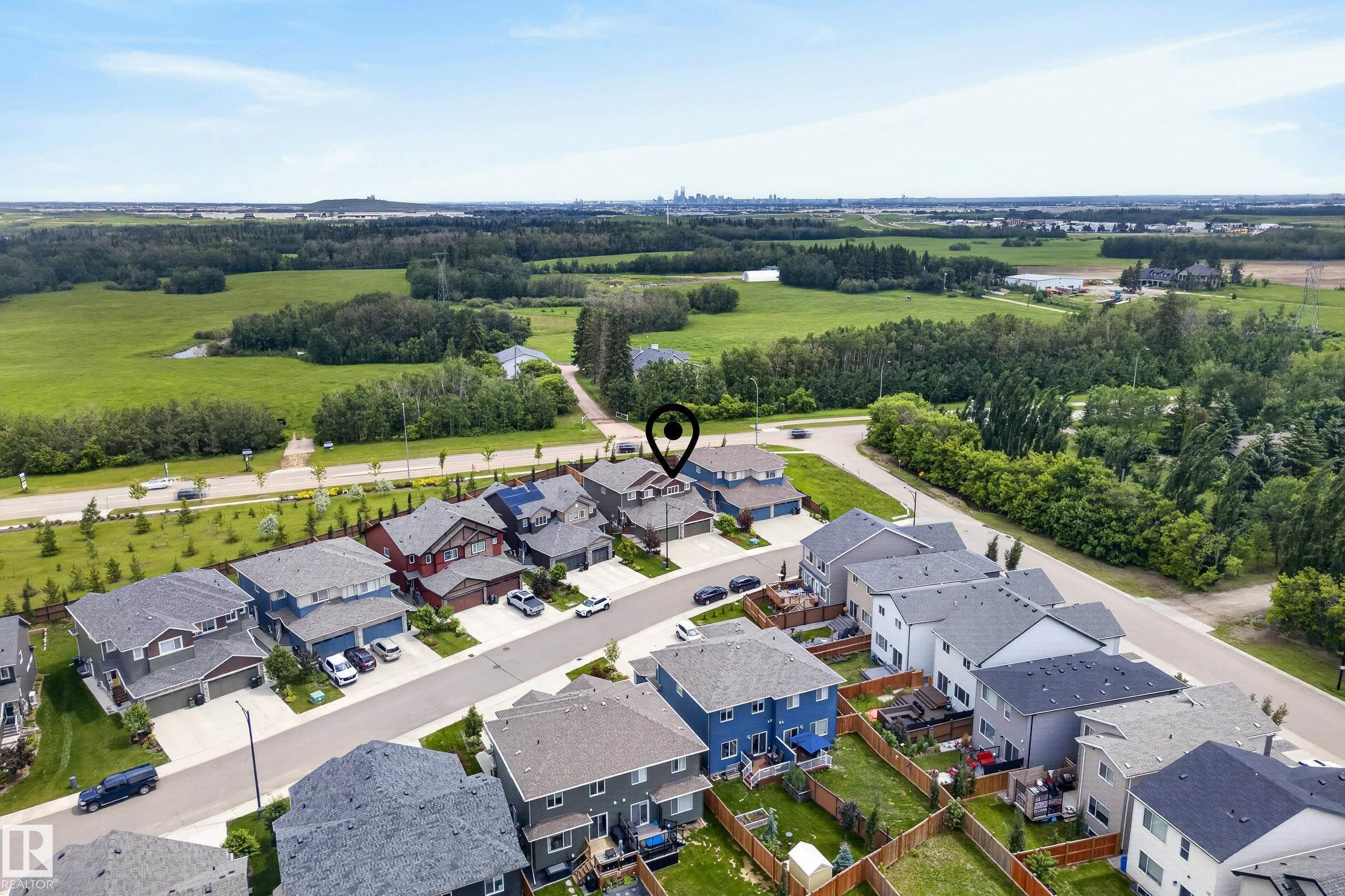Aerial perspective showcasing a residential neighborhood with surrounding green spaces - 5129 Lark Crescent Nw, Edmonton, AB - Outdoor With View