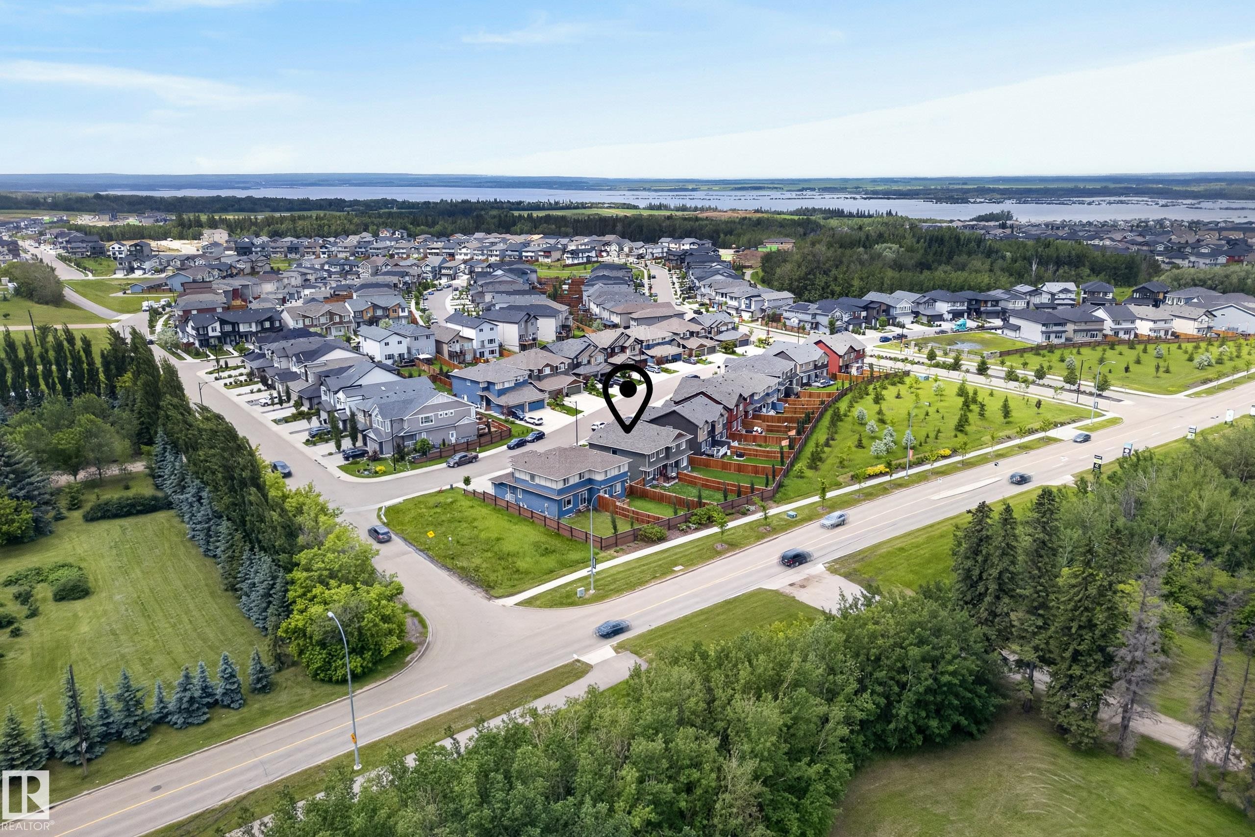 Aerial perspective showcasing a residential development with a variety of architectural styles - 5129 Lark Crescent Nw, Edmonton, AB - Outdoor With View
