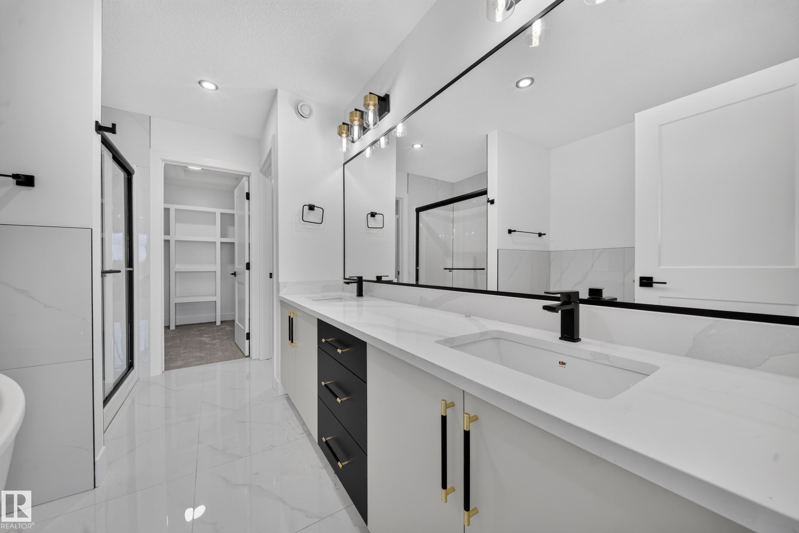 Bright room featuring a large window, neutral carpet, white walls, and a contemporary ceiling fixture - 803 30 Avenue, Edmonton, AB