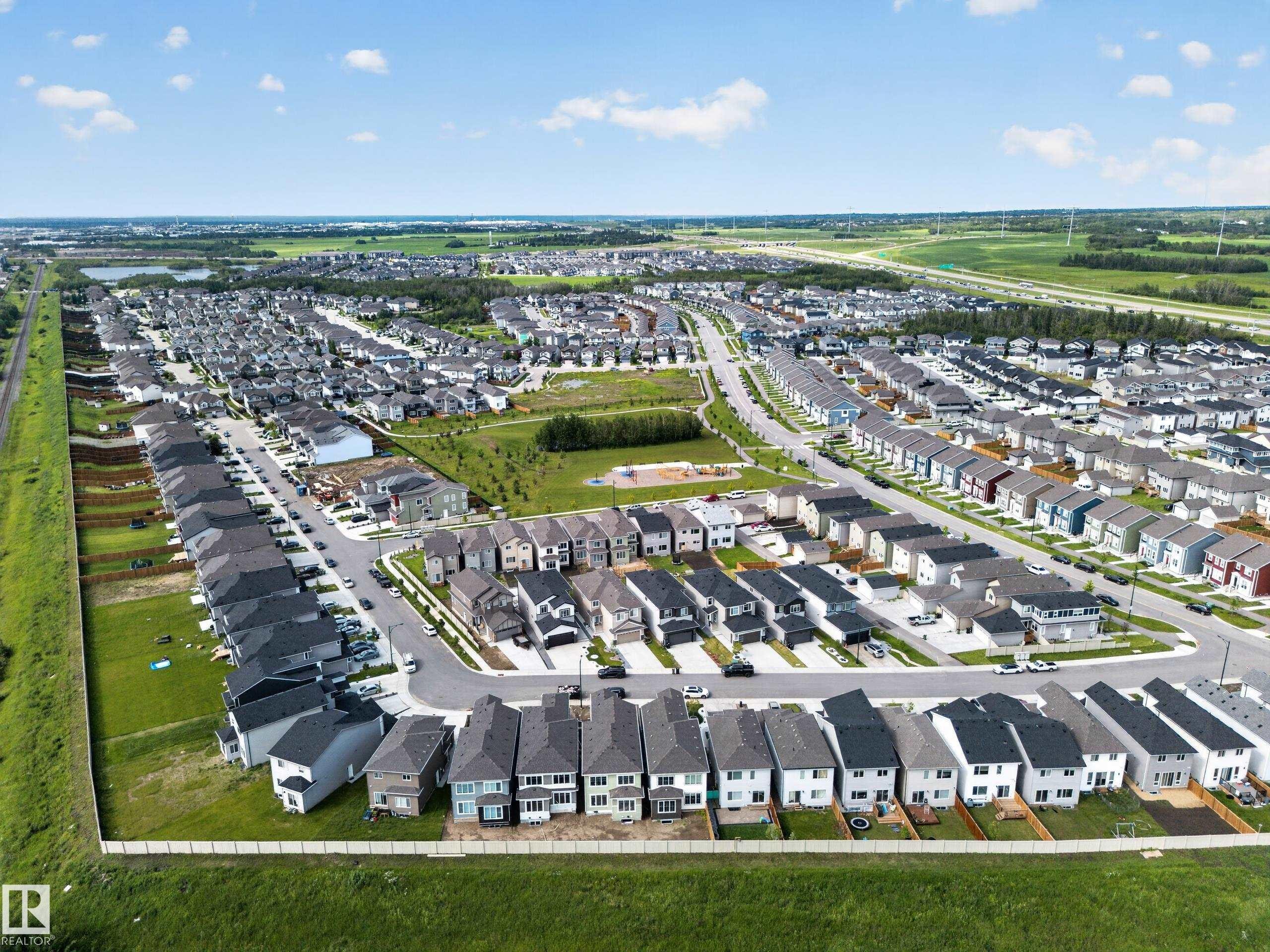 Expansive residential development featuring multiple streets of detached homes with varied exterior finishes - 803 30 Avenue, Edmonton, AB