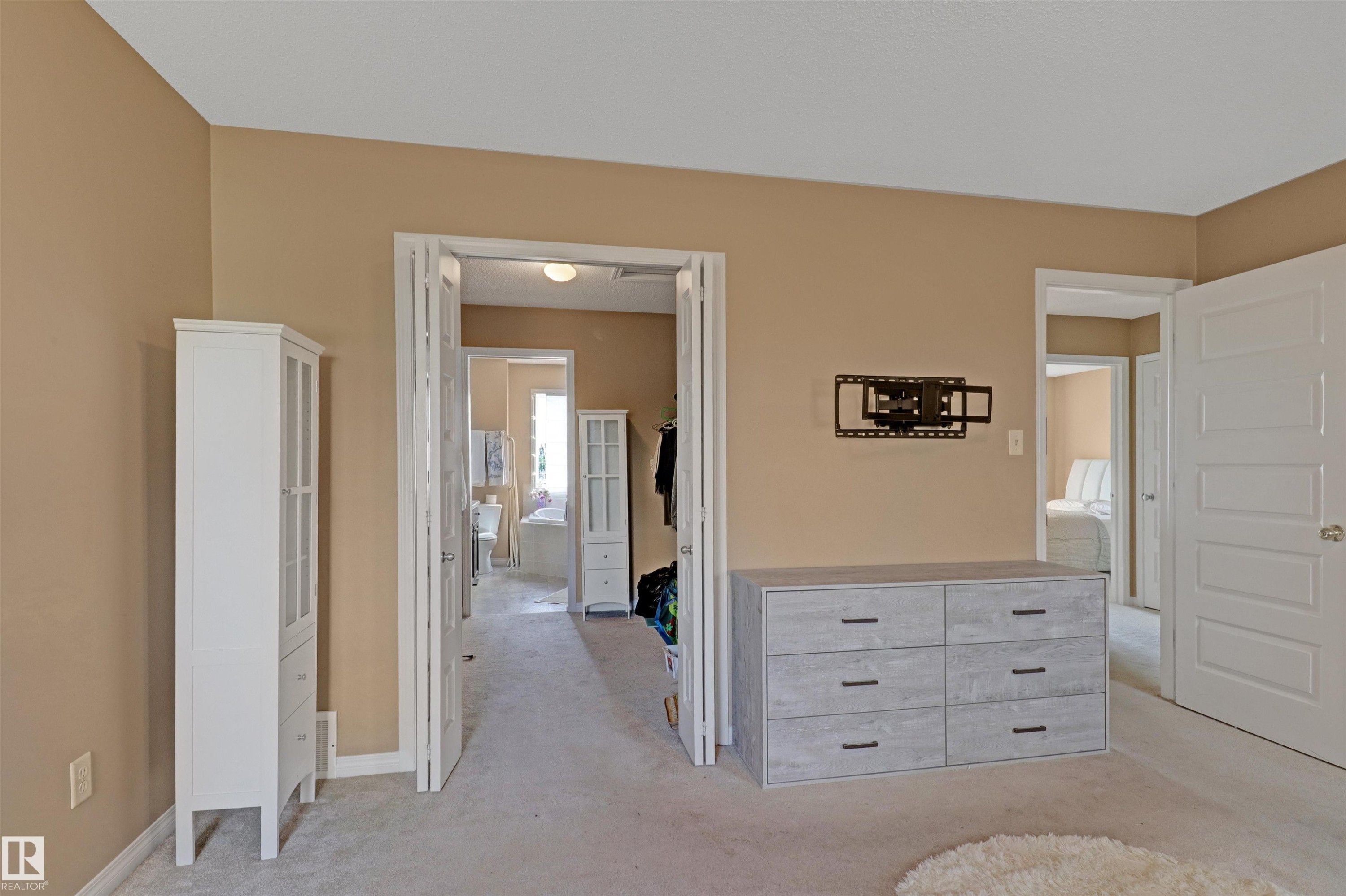 Wall-mounted television bracket for flexible viewing - 1216 37C Avenue Nw, Edmonton, AB - Indoor