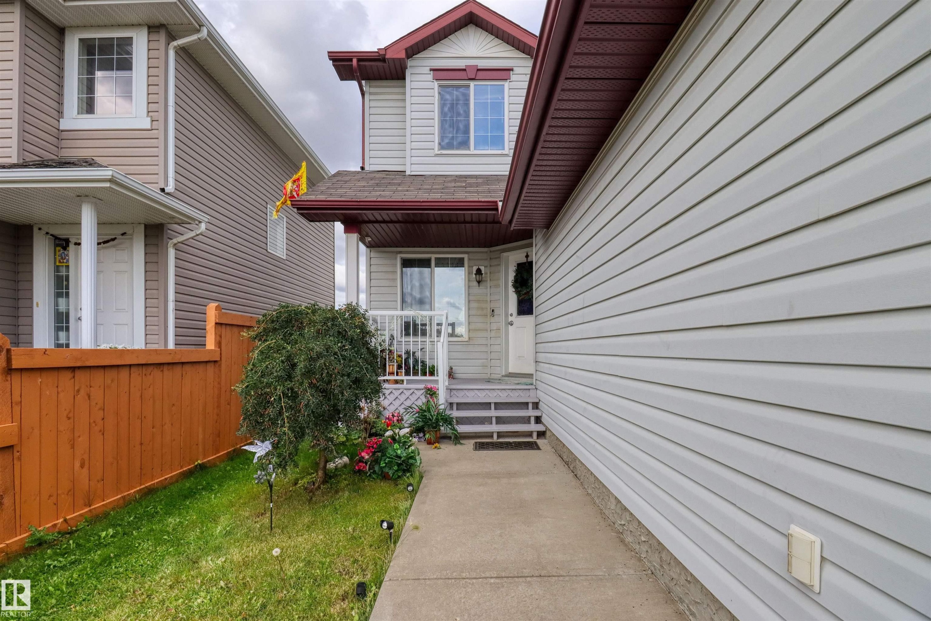 Two-story residence featuring light gray siding and a dark red roofline - 1216 37C Avenue Nw, Edmonton, AB - Outdoor With Exterior