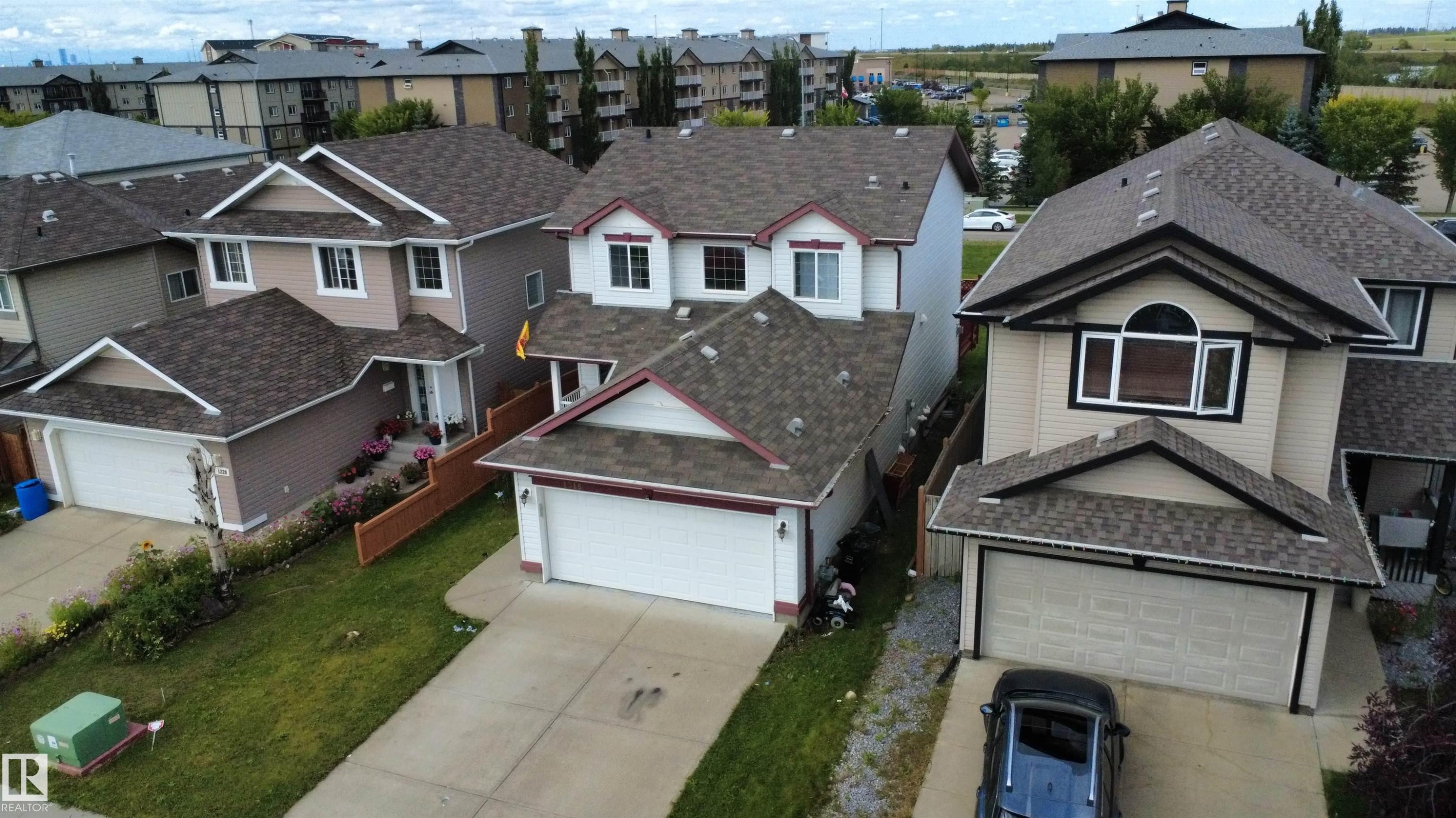 Contemporary two-story residence with attached double garage, featuring a peaked roofline and dormer windows - 1216 37C Avenue Nw, Edmonton, AB - Outdoor With Facade