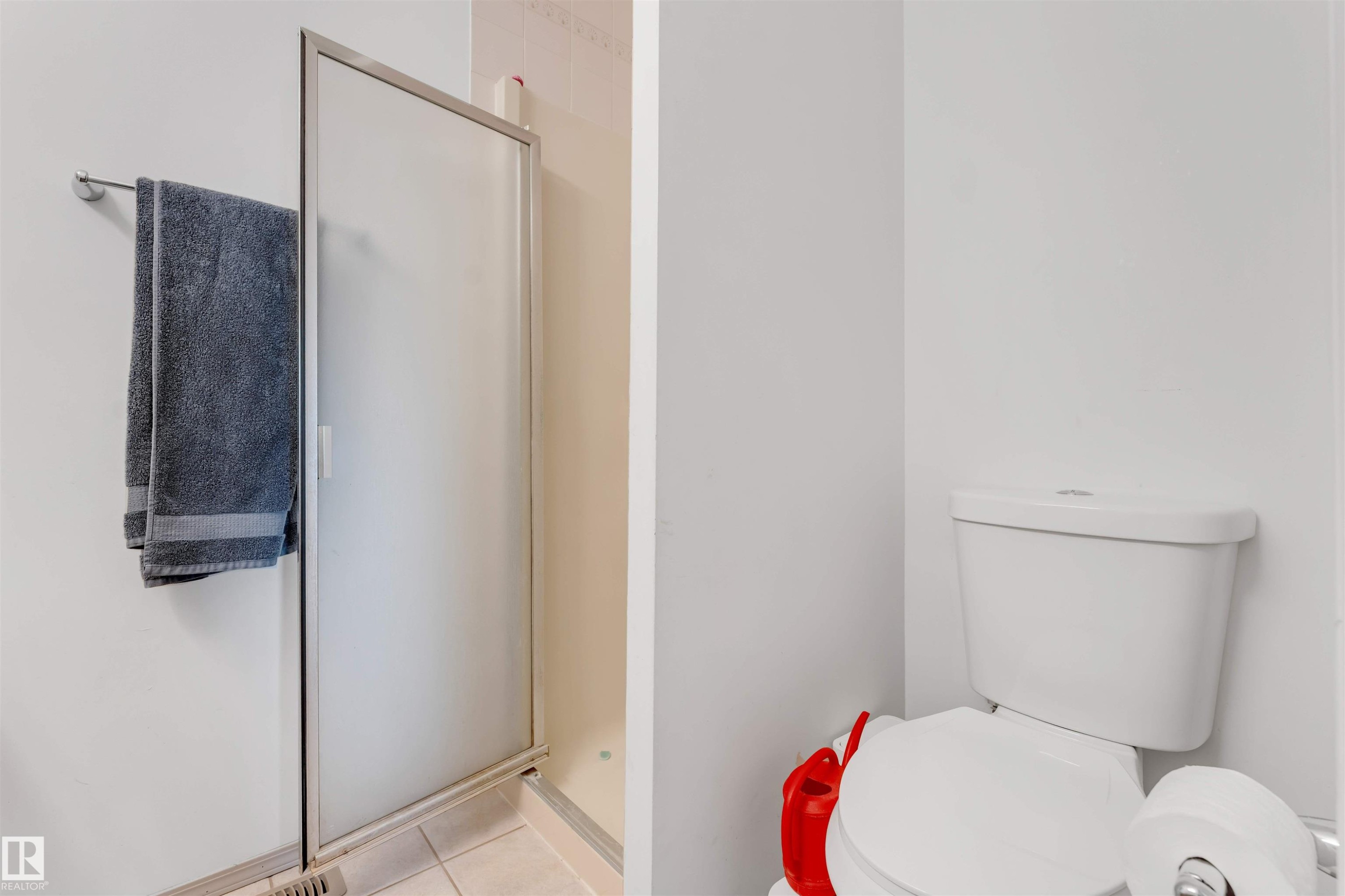 Shower enclosure with frosted glass door and tile flooring - 3332 43 Street Nw, Edmonton, AB