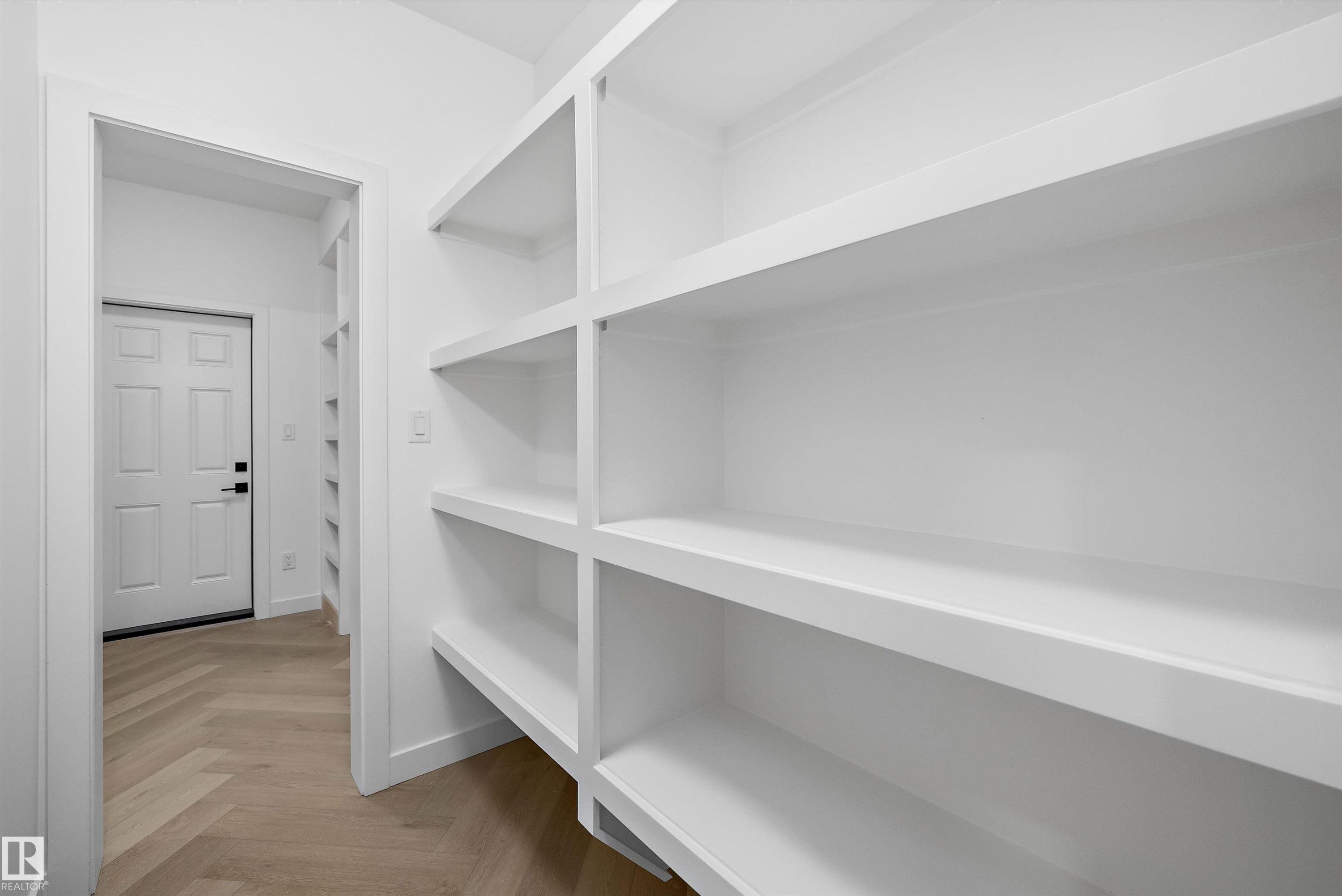 Built-in white shelving providing extensive storage - 917 Elderberry Landing, Edmonton, AB