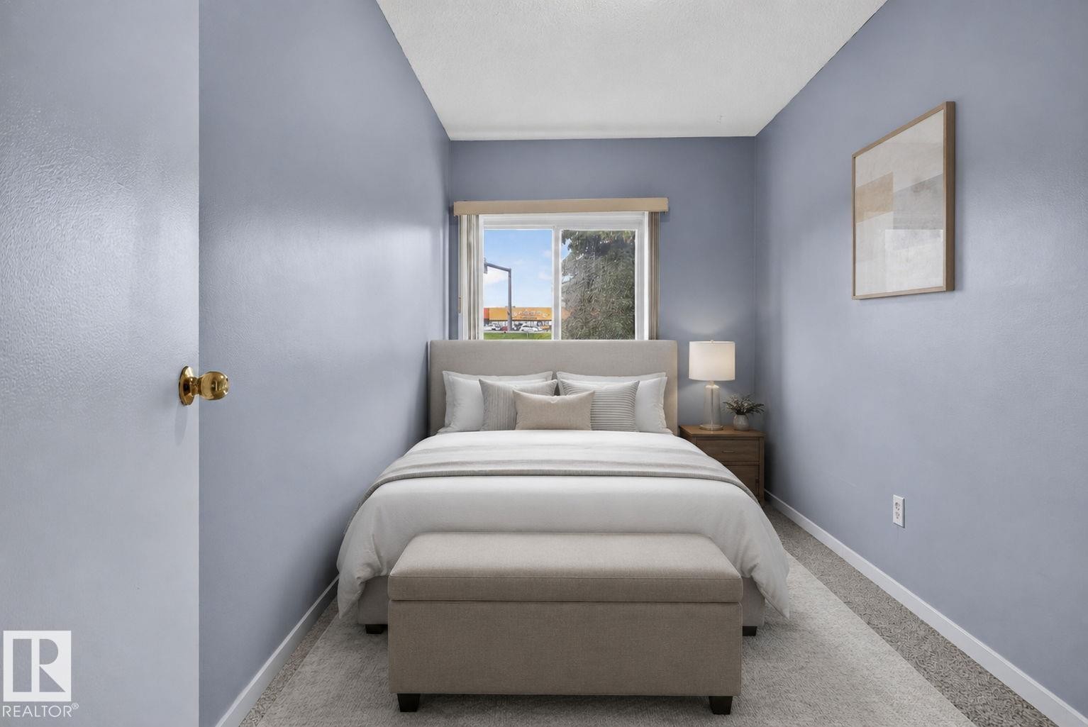 Bedroom featuring light blue wall paint, a window with a valance, and carpeted flooring - 401 2908 116A Avenue, Edmonton, AB