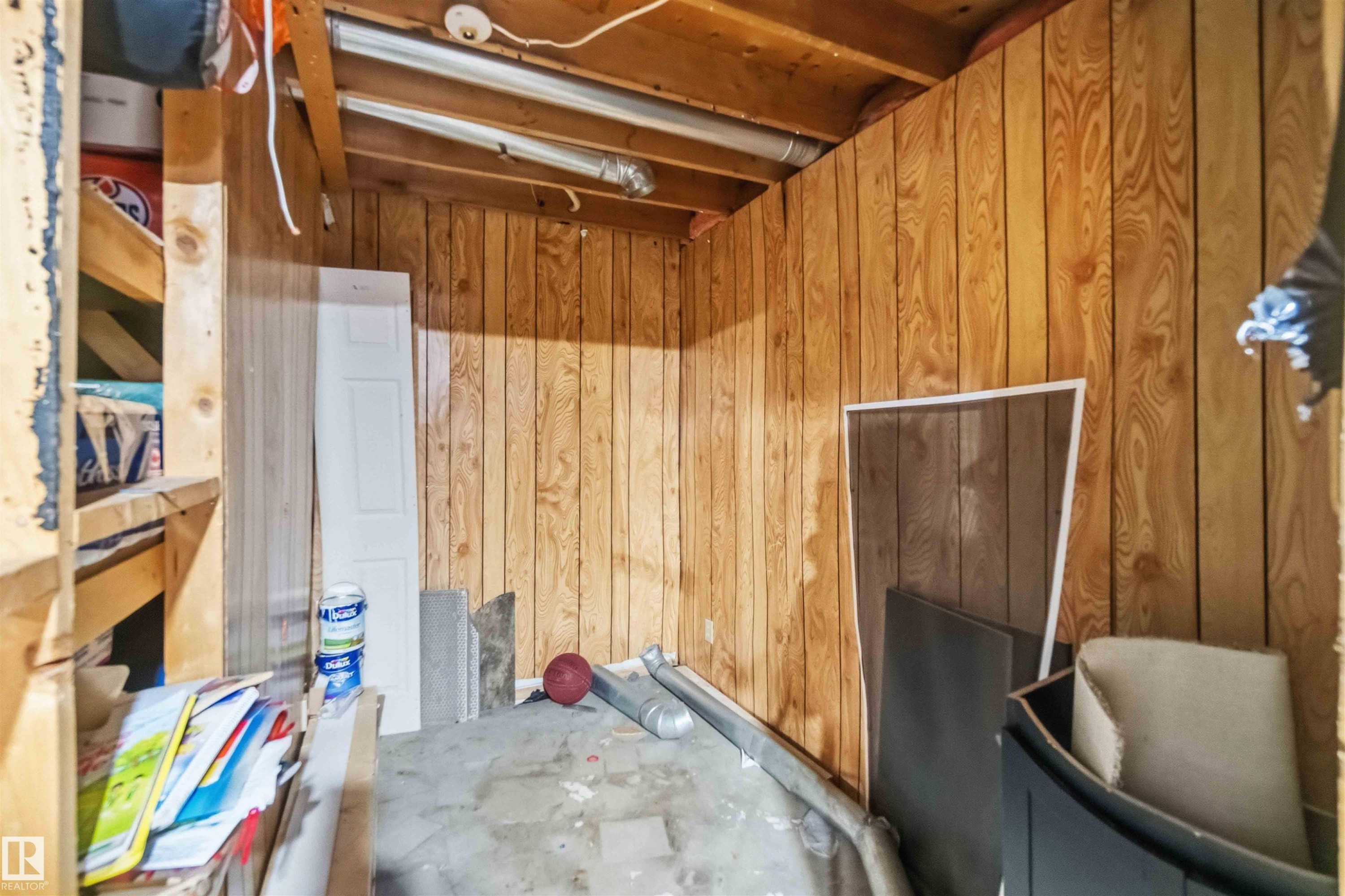 Interior utility space featuring wood paneling on walls - 17118 108 Street, Edmonton, AB
