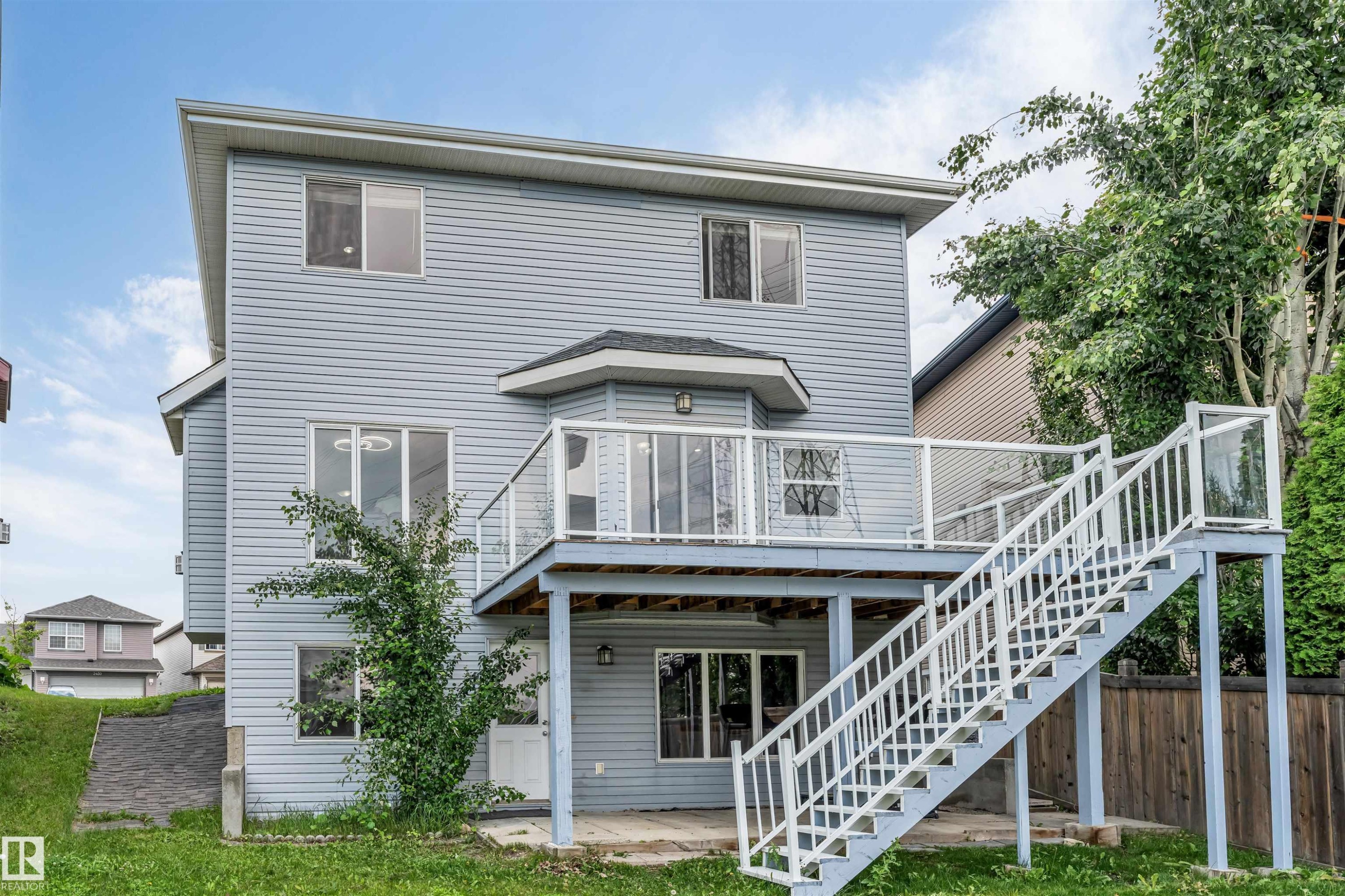 Two-story exterior with light blue siding - 3449 28 Street, Edmonton, AB