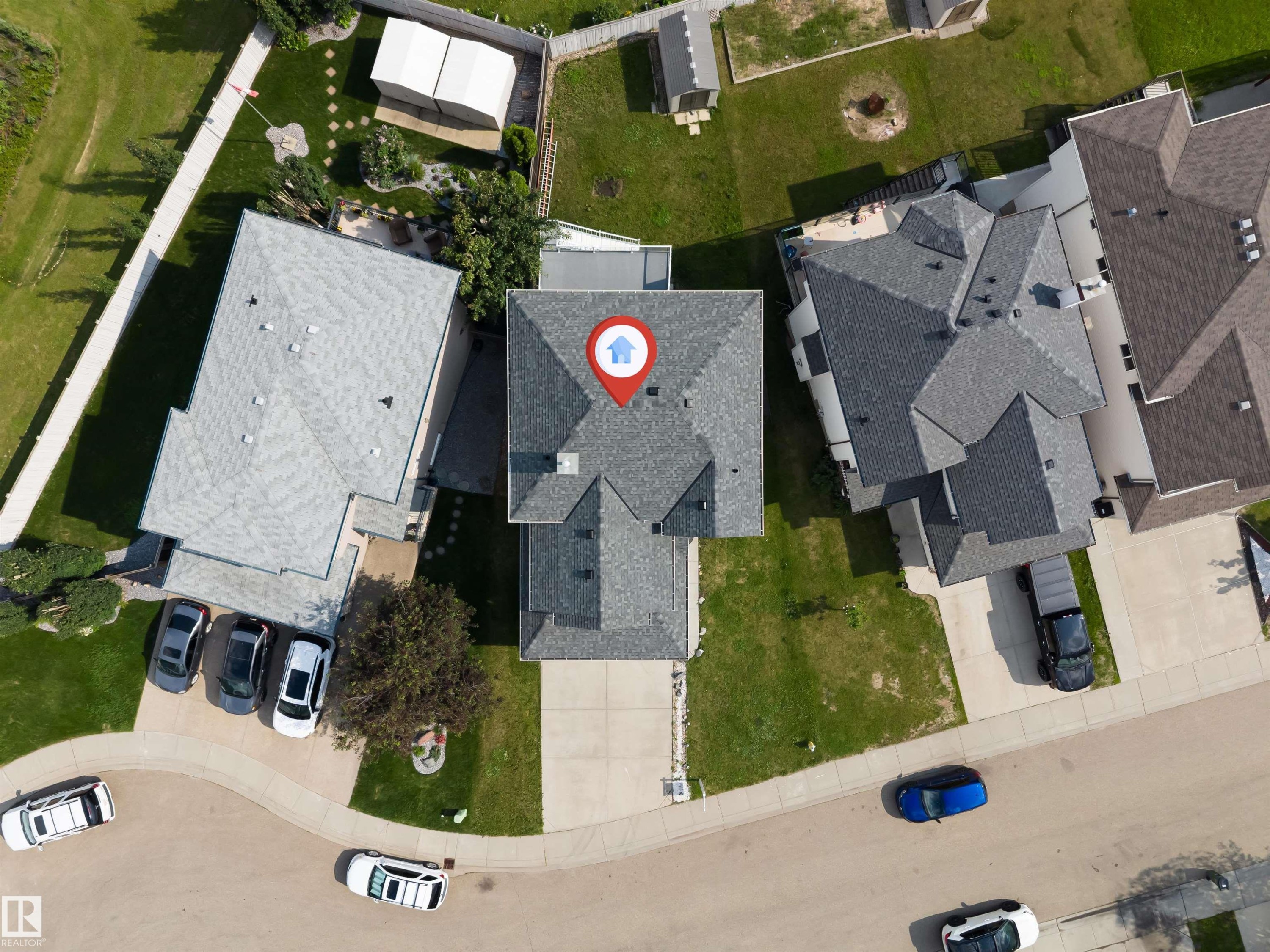Aerial view highlighting a residential property with a multi-gabled roof and a concrete driveway - 3449 28 Street, Edmonton, AB