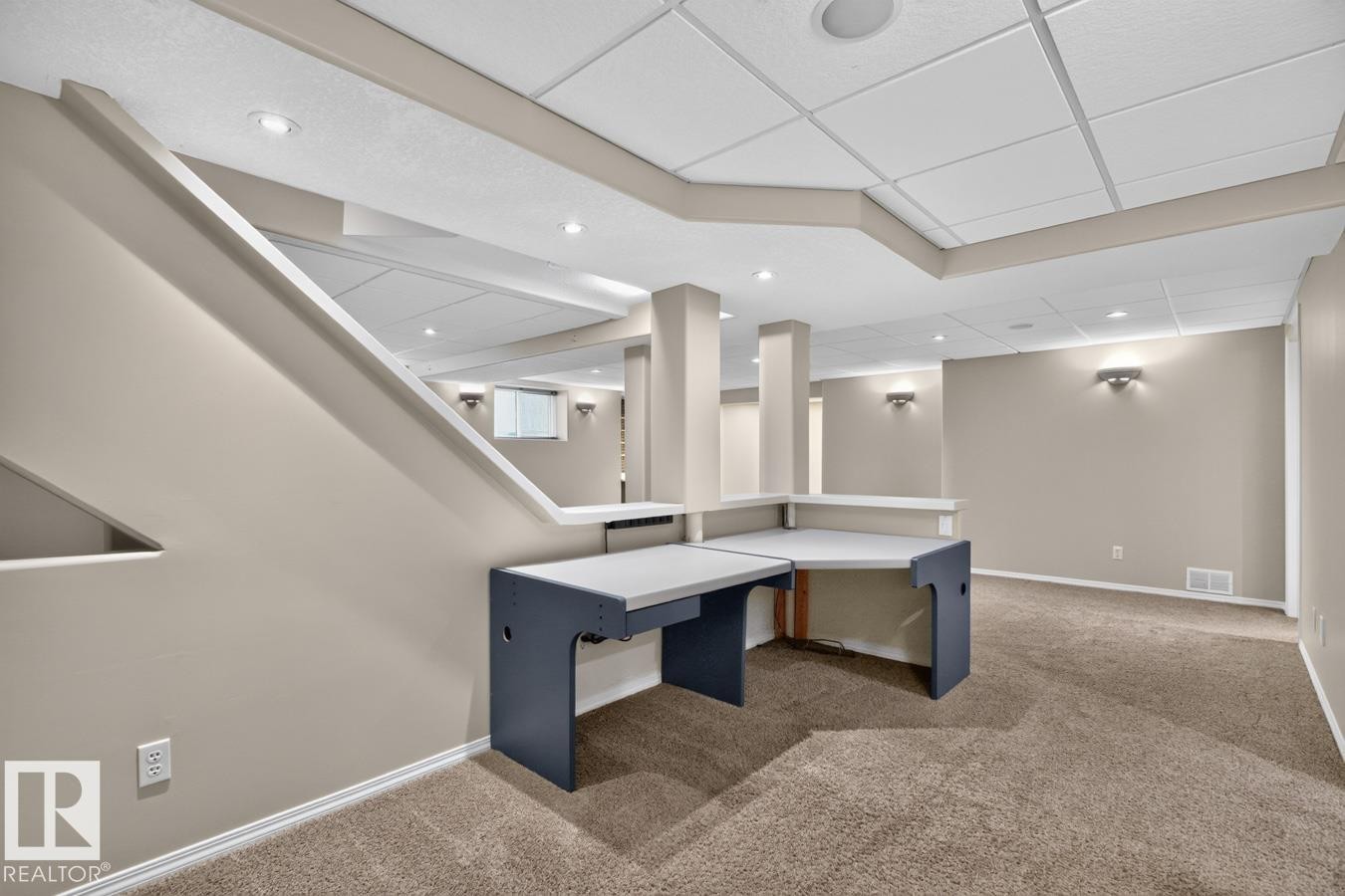 Finished lower level featuring neutral wall tones, recessed lighting, and a built-in desk area - 448 Ormsby Road Nw, Edmonton, AB - Indoor Photo Showing Other Room