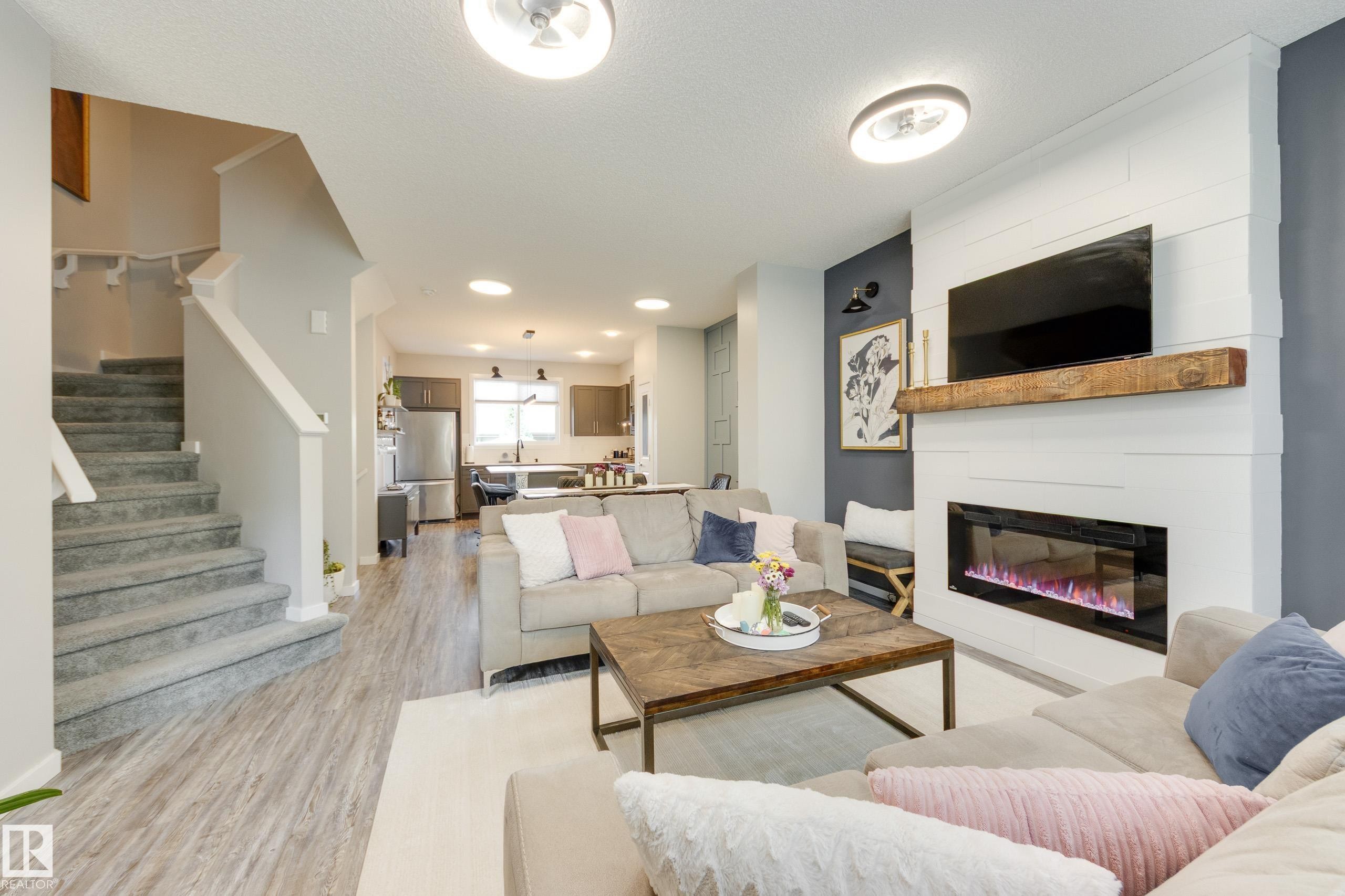 1192 Rosenthal Boulevard Nw, Edmonton, AB - Indoor Photo Showing Living Room With Fireplace