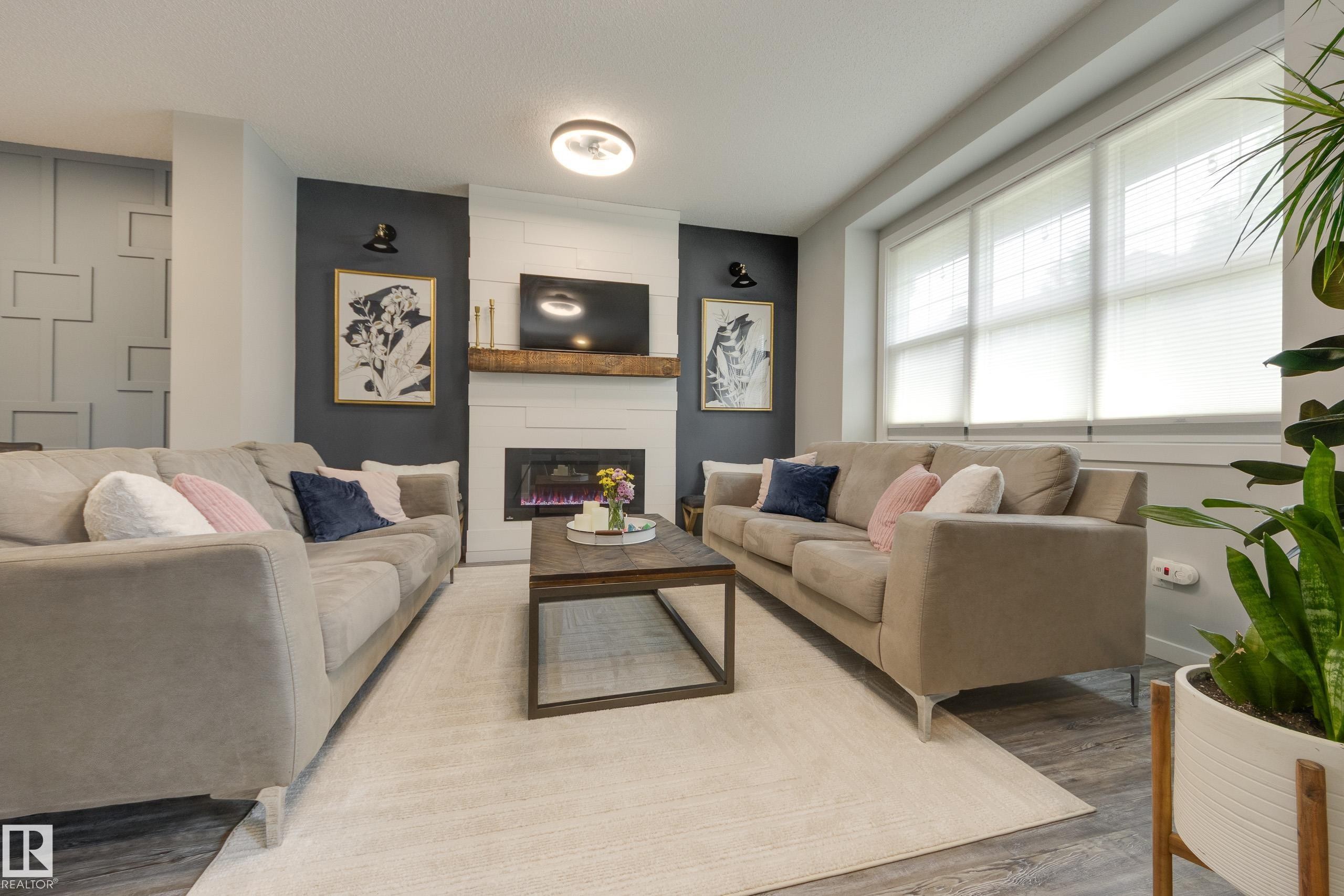 1192 Rosenthal Boulevard Nw, Edmonton, AB - Indoor Photo Showing Living Room With Fireplace