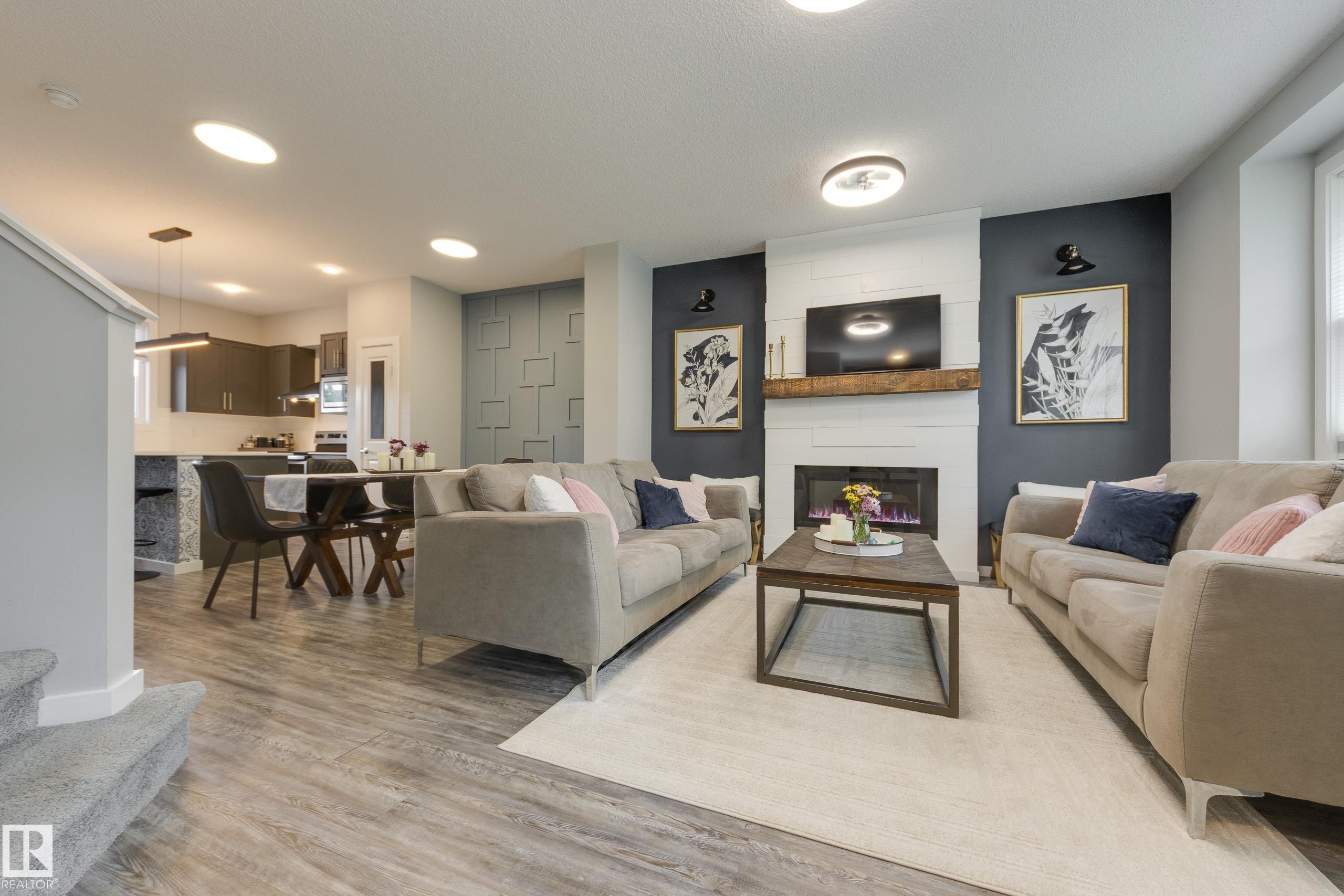 1192 Rosenthal Boulevard Nw, Edmonton, AB - Indoor Photo Showing Living Room With Fireplace