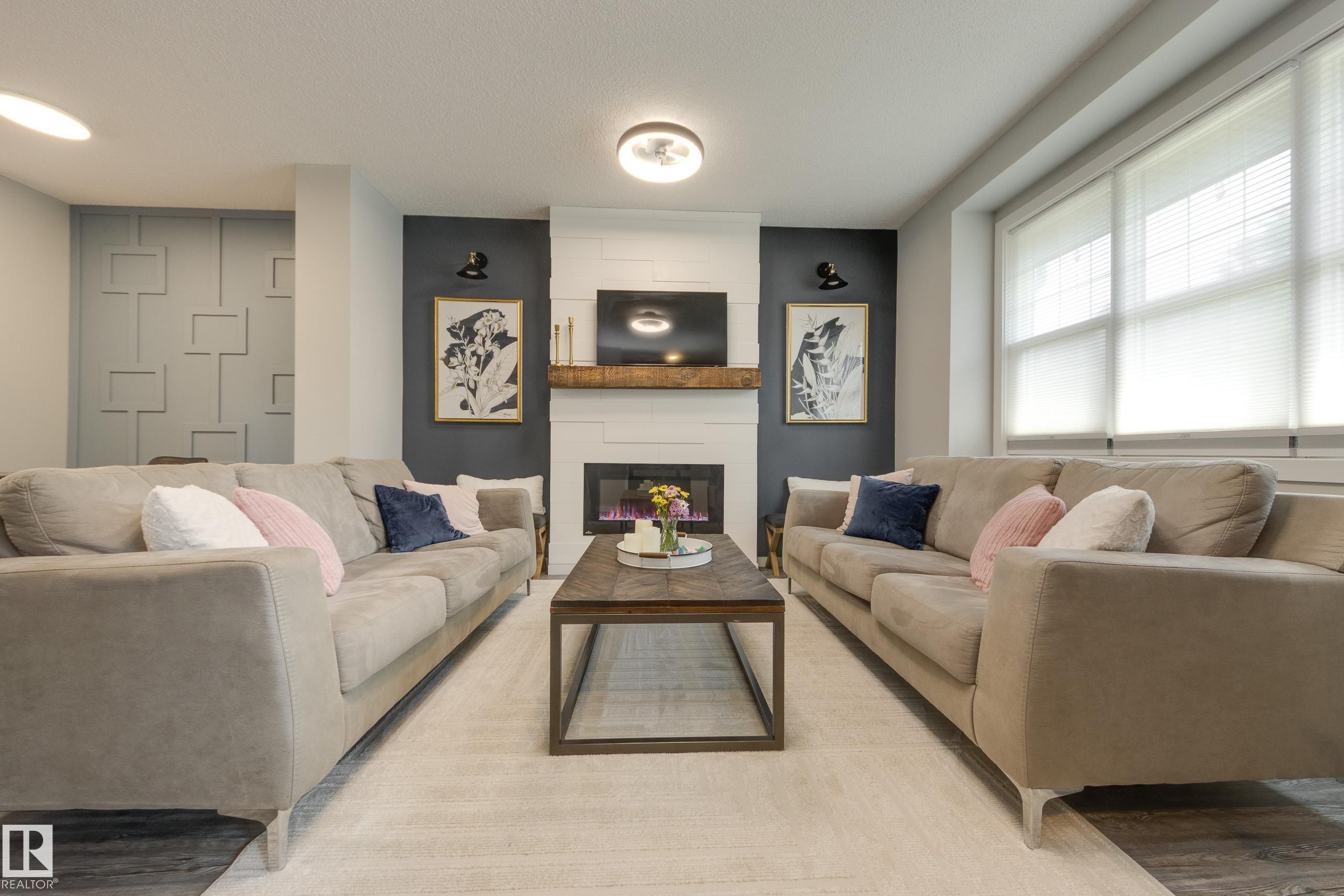 1192 Rosenthal Boulevard Nw, Edmonton, AB - Indoor Photo Showing Living Room With Fireplace
