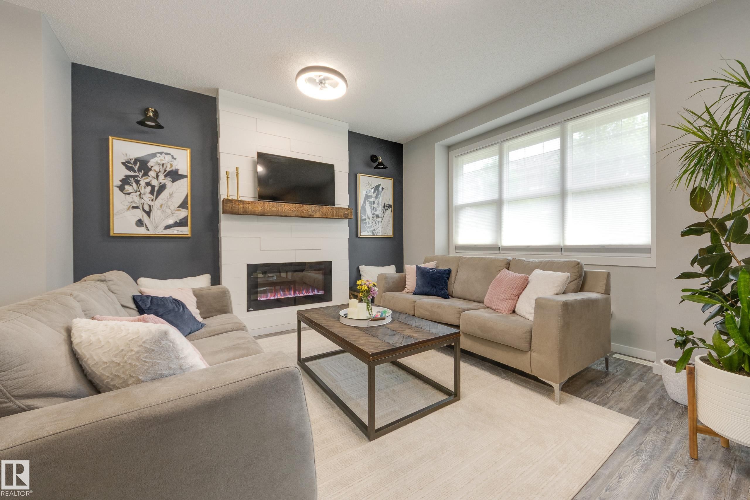 1192 Rosenthal Boulevard Nw, Edmonton, AB - Indoor Photo Showing Living Room With Fireplace