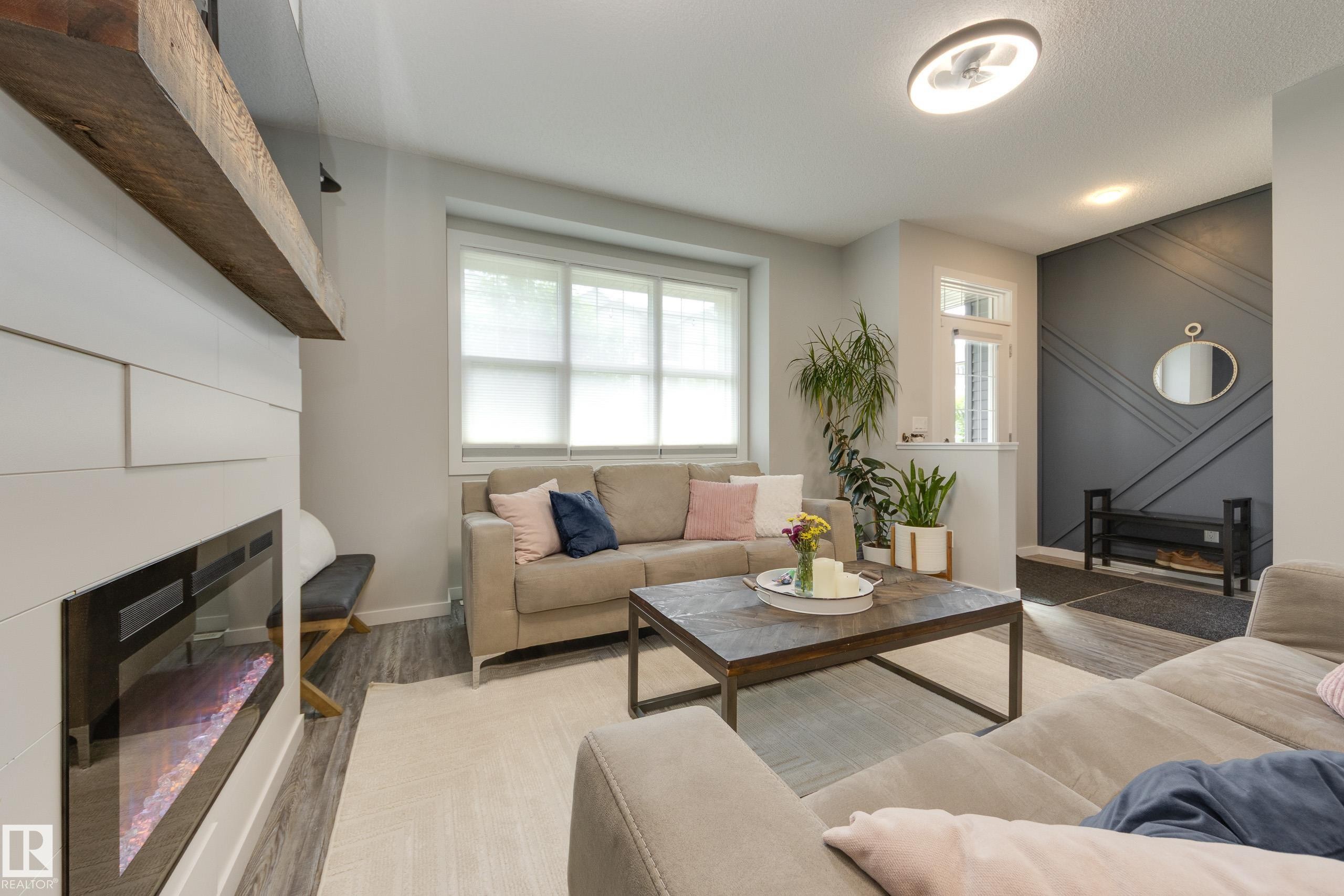 1192 Rosenthal Boulevard Nw, Edmonton, AB - Indoor Photo Showing Living Room With Fireplace