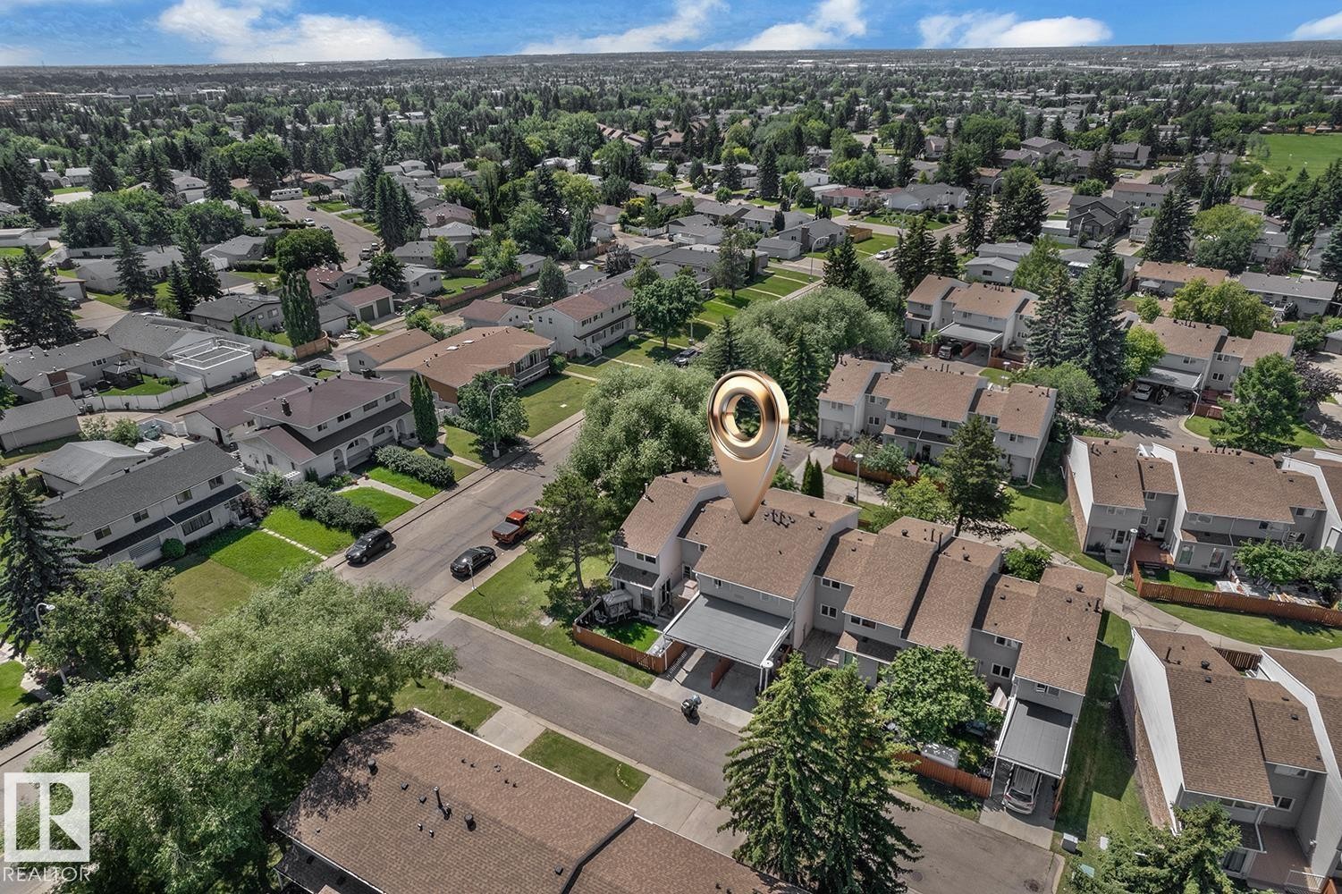 Aerial perspective showcasing residential properties with light-colored siding and sloped brown roofs - 6632 36A Avenue, Edmonton, AB