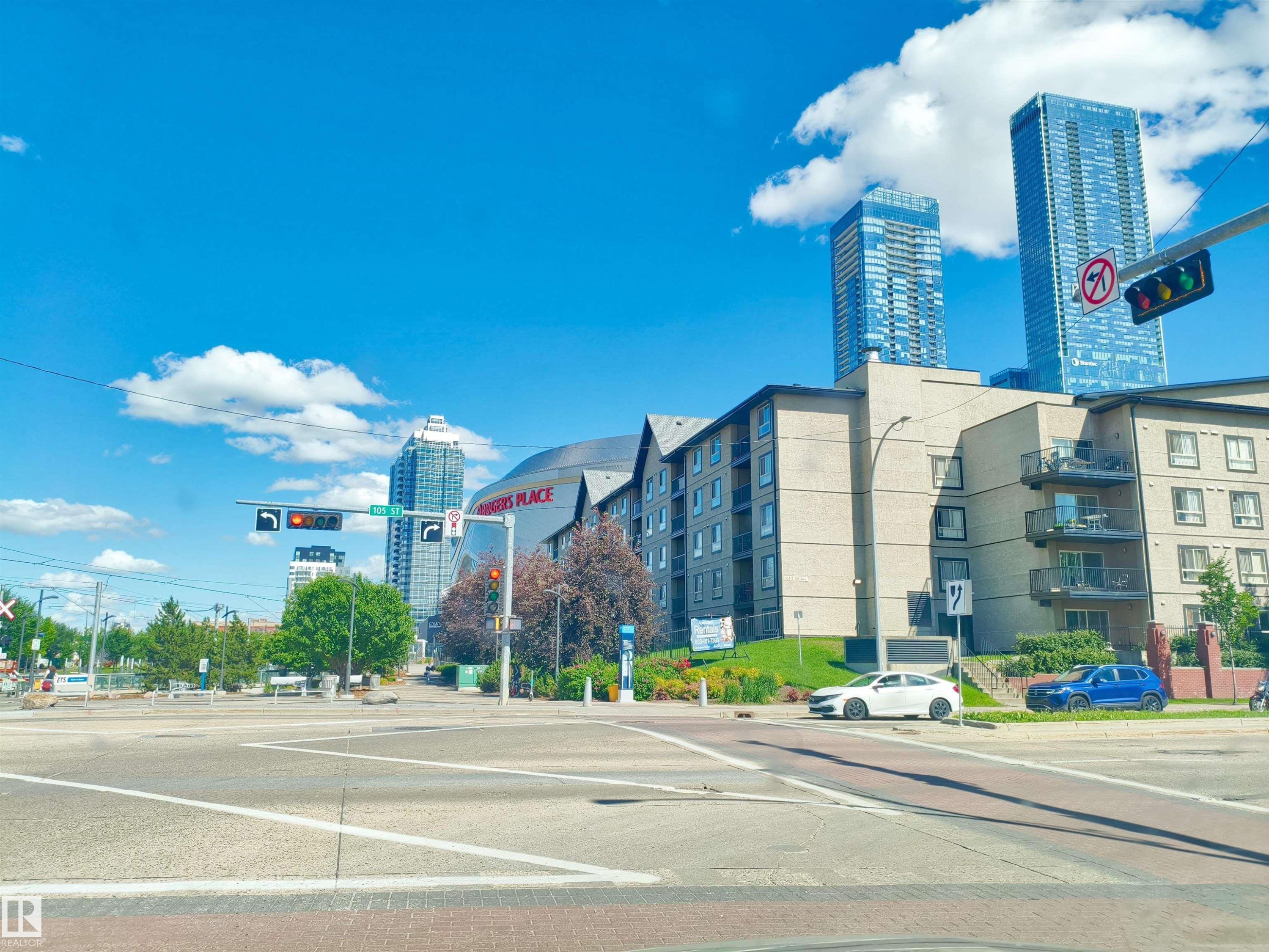 Multi-story residential building featuring balconies and a neutral-toned exterior - #2505 10410 102 Av Nw, Edmonton, AB - Outdoor