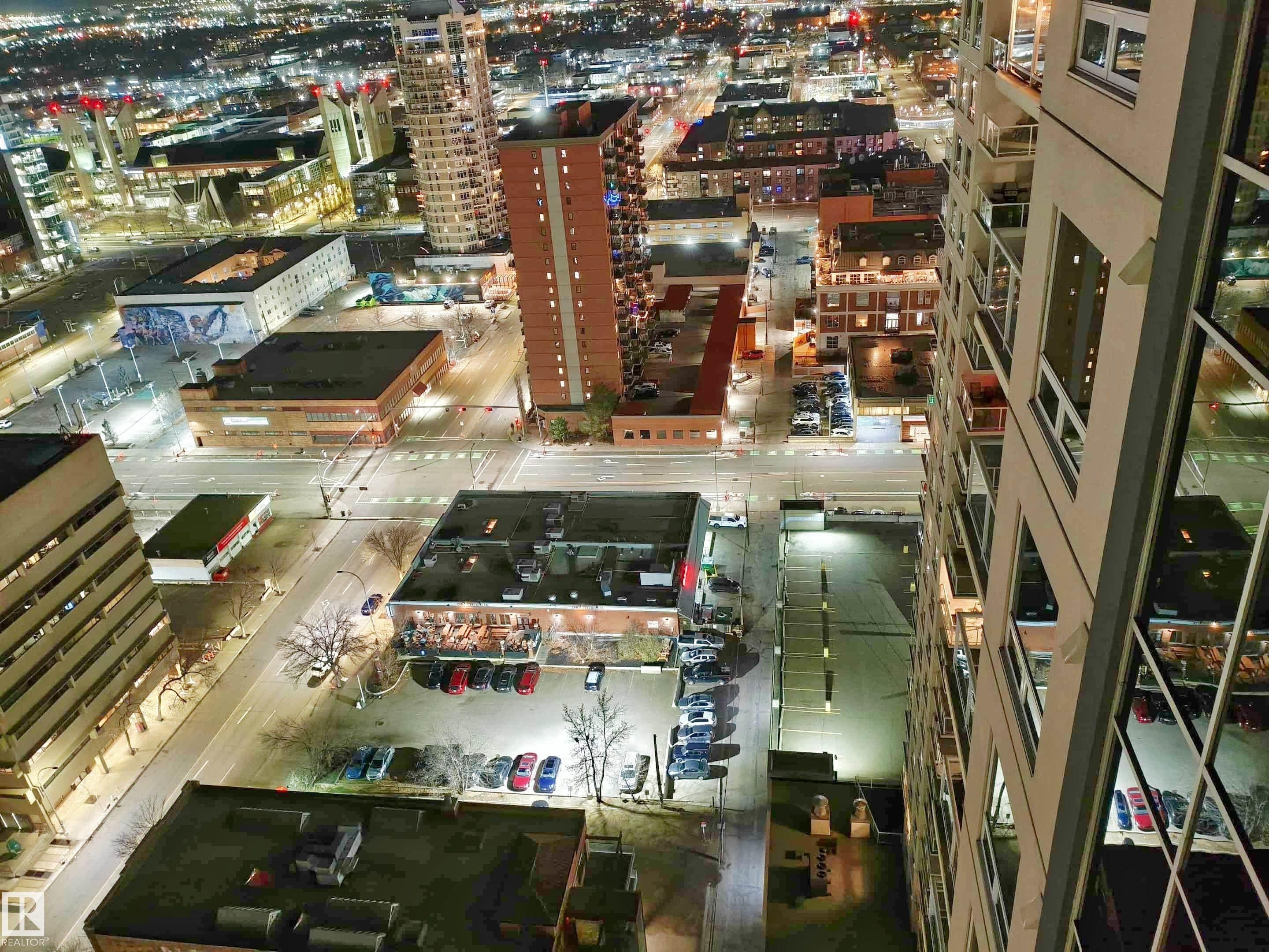 Cityscape featuring high-rise buildings and illuminated roadways - #2505 10410 102 Av Nw, Edmonton, AB - Outdoor With View