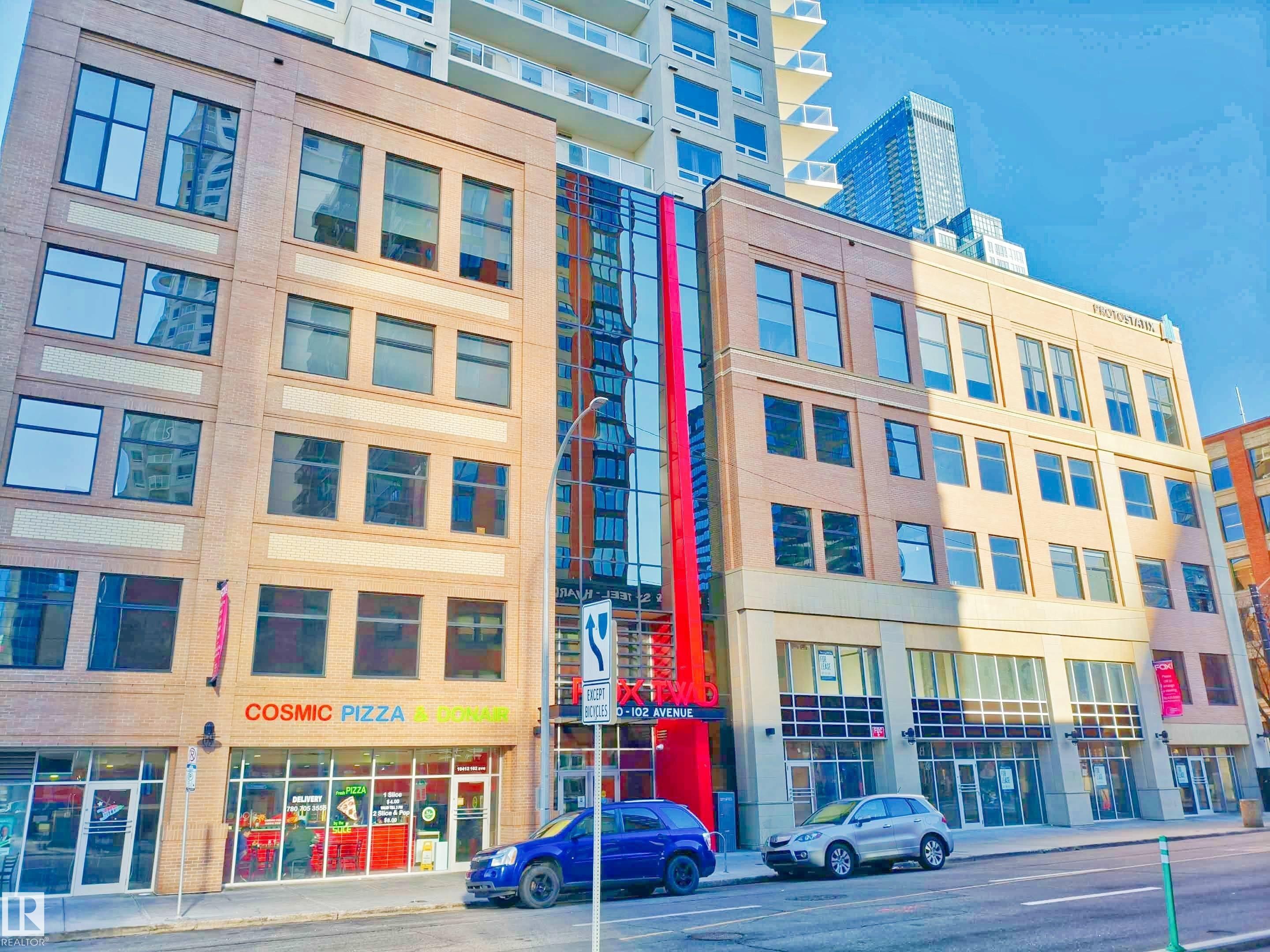 Multi-story building featuring a brick facade with horizontal banding - #2505 10410 102 Av Nw, Edmonton, AB - Photo Showing Other Room