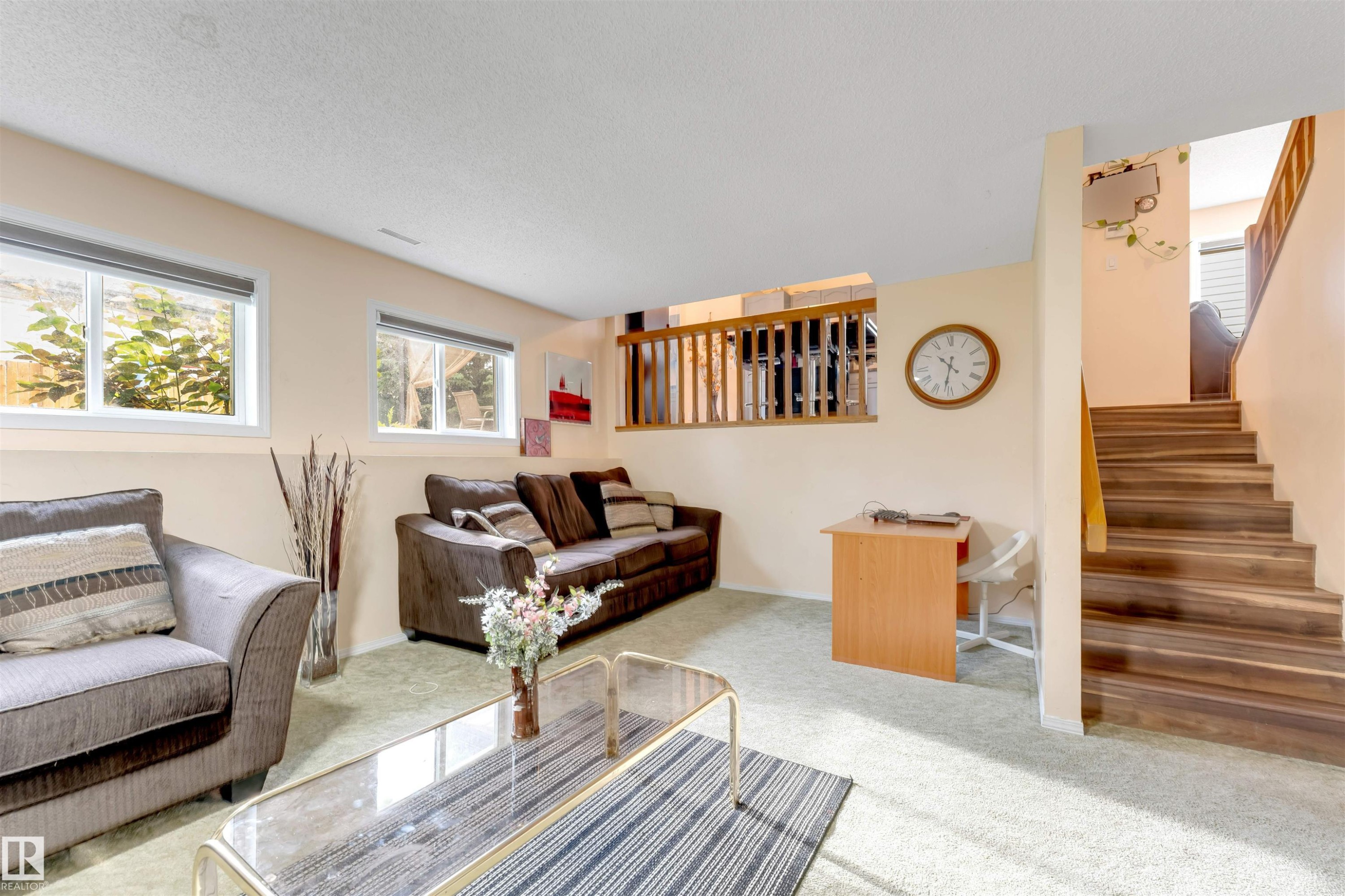 Recreation room with light beige walls and light green carpet flooring - 312 Beringer Crescent Nw, Edmonton, AB - Indoor Photo Showing Living Room