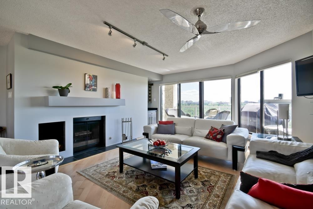 #7 9734 111 St Nw, Edmonton, AB - Indoor Photo Showing Living Room With Fireplace