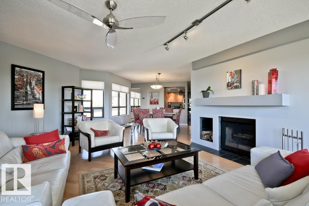 #7 9734 111 St Nw, Edmonton, AB - Indoor Photo Showing Living Room With Fireplace