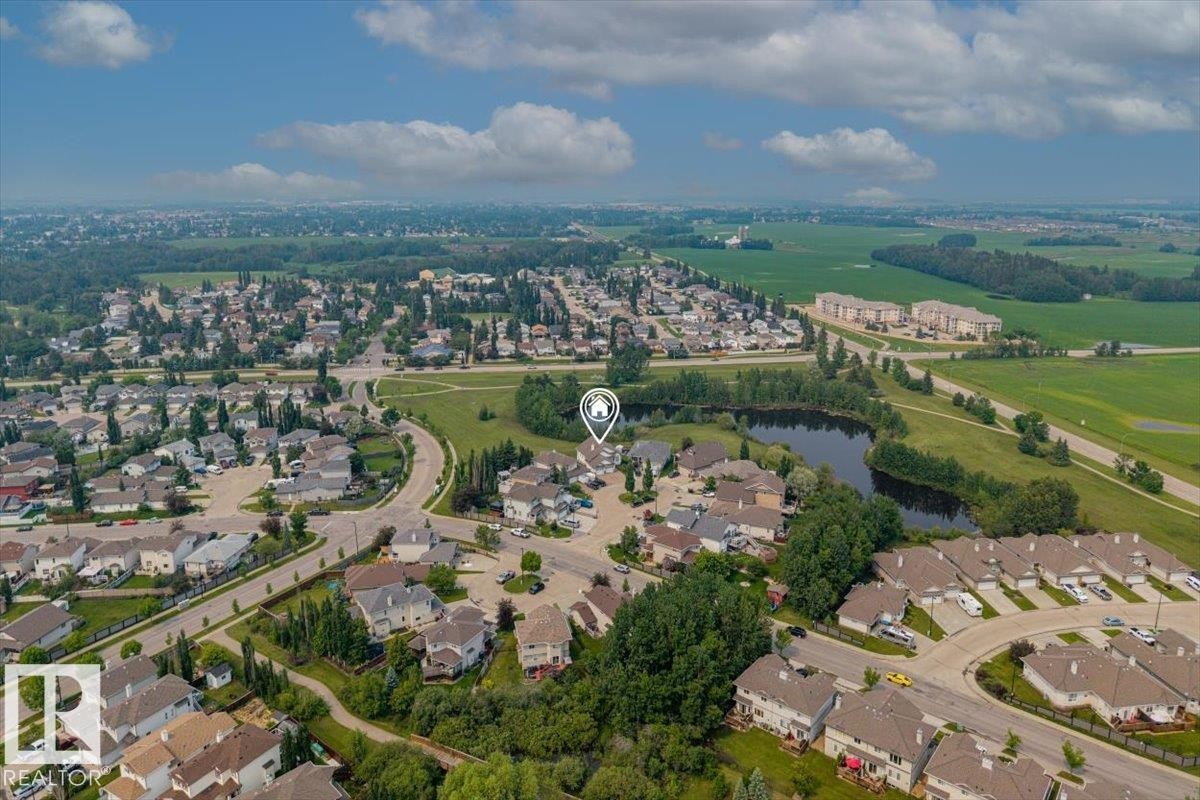 Aerial view showcasing a residential neighborhood with varied housing styles - 215 Westerra Point(E), Stony Plain, AB
