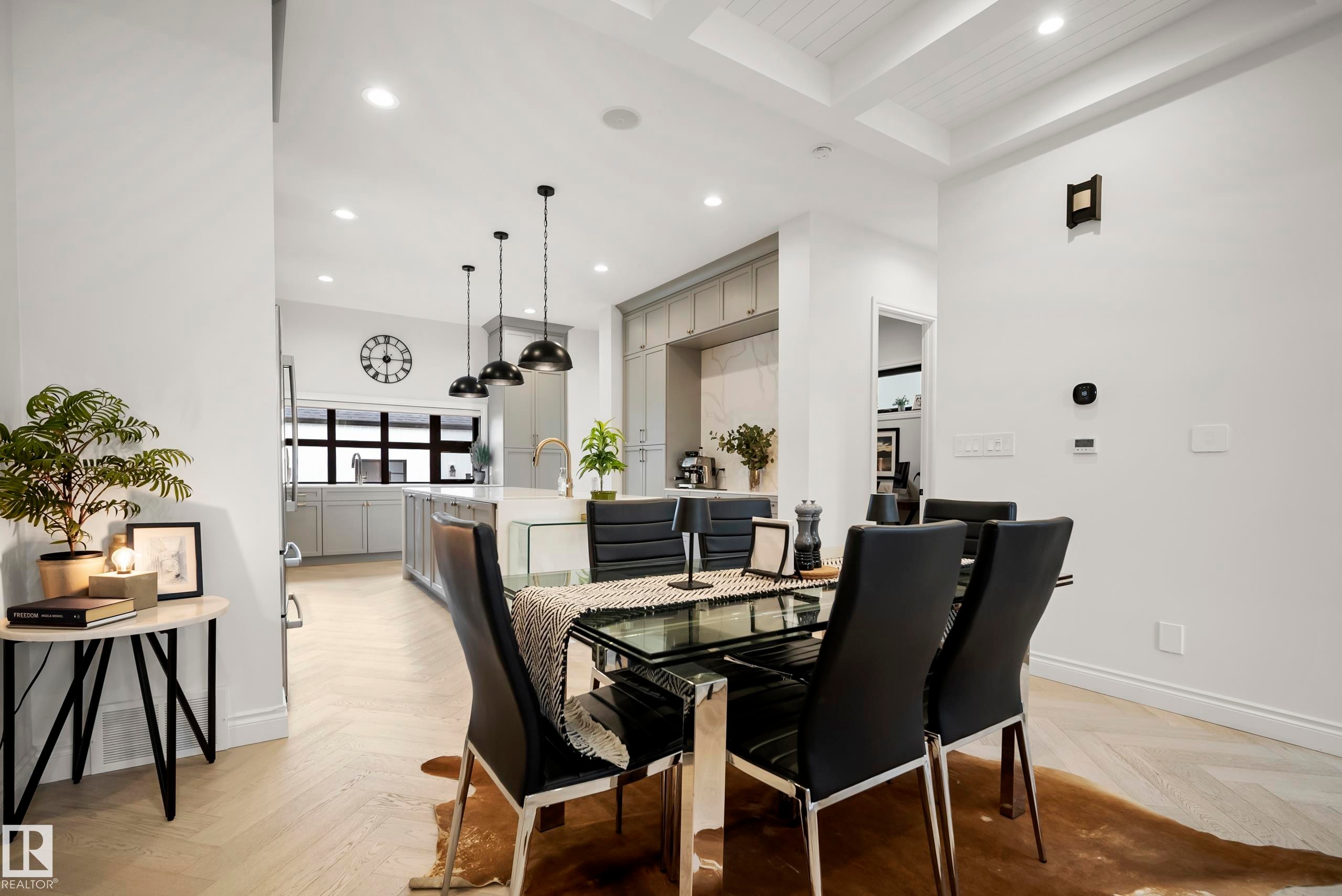 Open-concept dining area featuring light wood-finish flooring, a coffered ceiling, and recessed lighting - 6115 111 Avenue, Edmonton, AB - Indoor Photo Showing Dining Room
