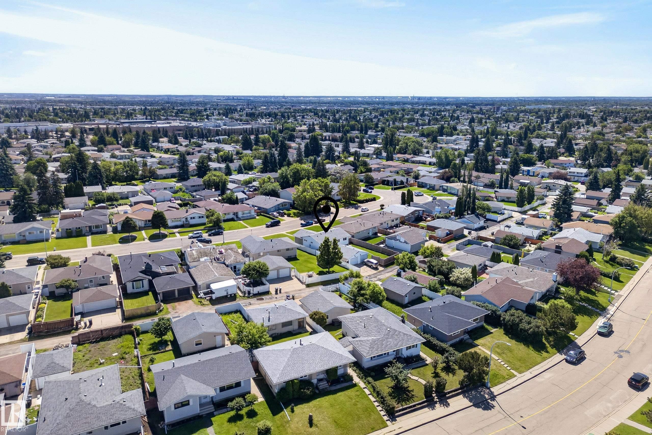 Residential neighborhood with detached homes, mature trees, and paved streets - 14128 73 Street, Edmonton, AB